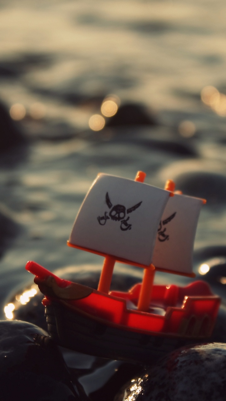 White and Red Plastic Toy. Wallpaper in 720x1280 Resolution