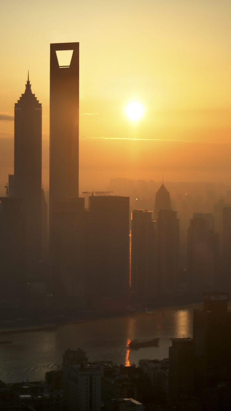 Silhouette of City Buildings During Sunset. Wallpaper in 750x1334 Resolution