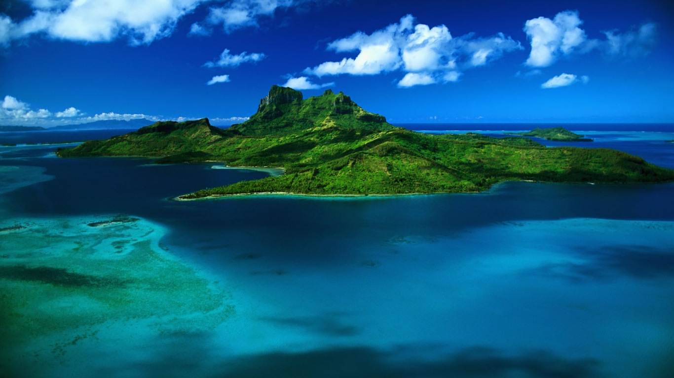 Green Mountain Beside Blue Sea Under Blue Sky and White Clouds During Daytime. Wallpaper in 1366x768 Resolution