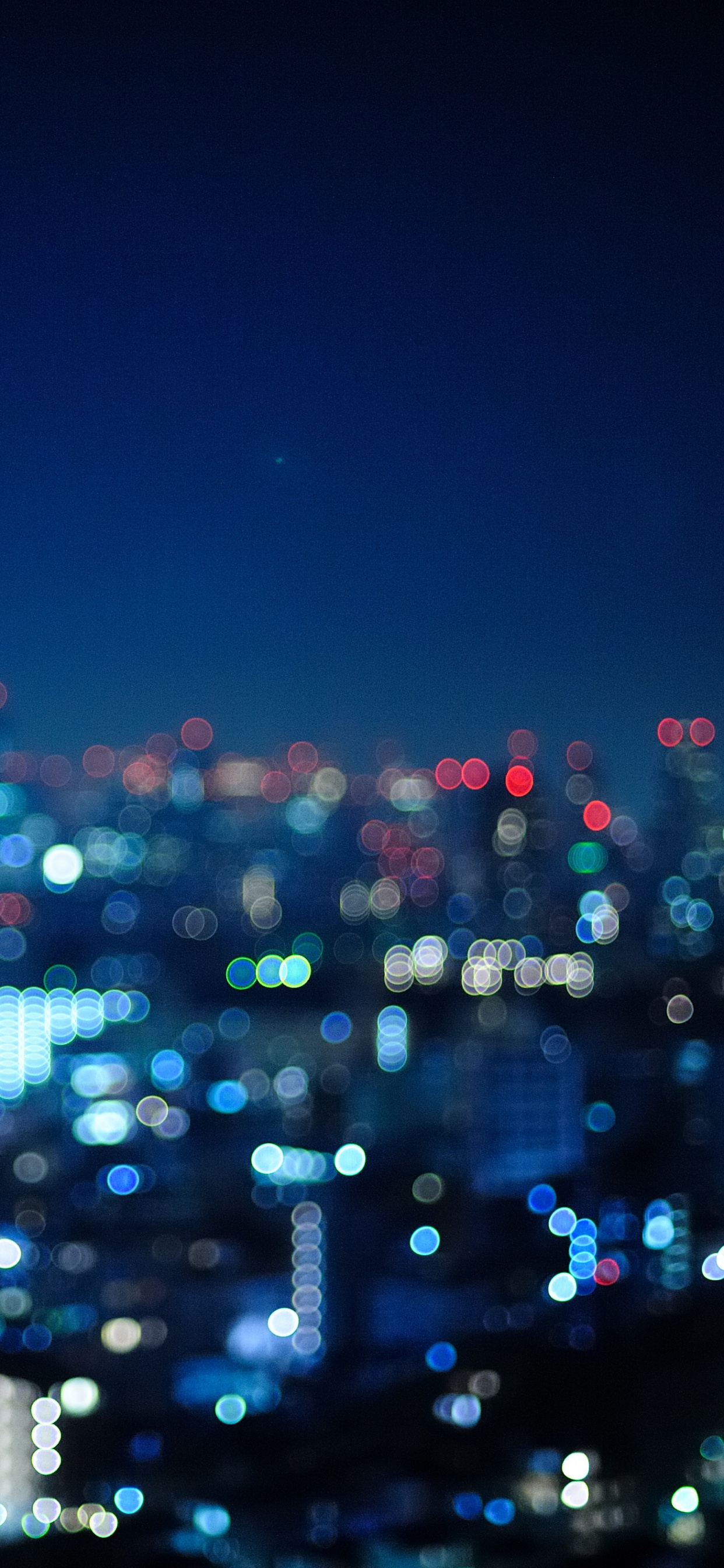 City Skyline During Night Time. Wallpaper in 1242x2688 Resolution