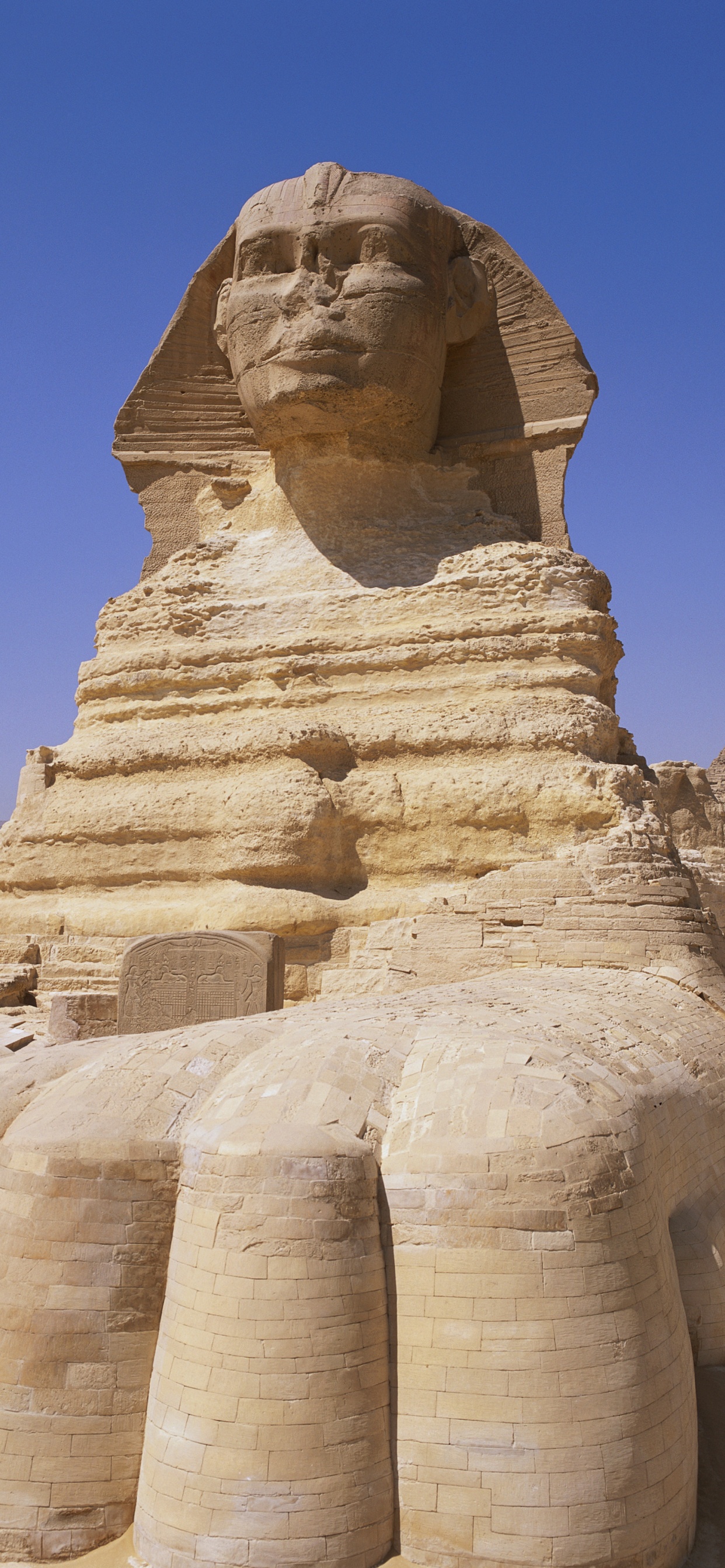 Brown Concrete Statue Under Blue Sky During Daytime. Wallpaper in 1242x2688 Resolution