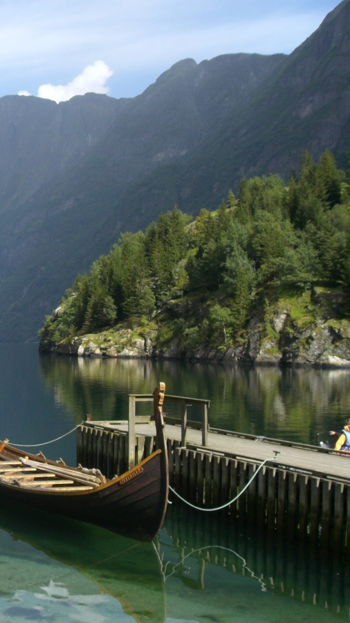 Brown Boat on Lake Near Green Mountains During Daytime. Wallpaper in 720x1280 Resolution