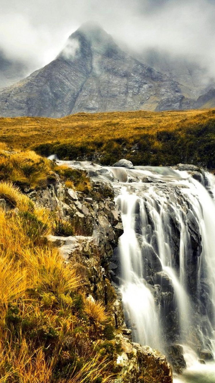 Green Grass and Brown Grass Near Waterfalls. Wallpaper in 750x1334 Resolution