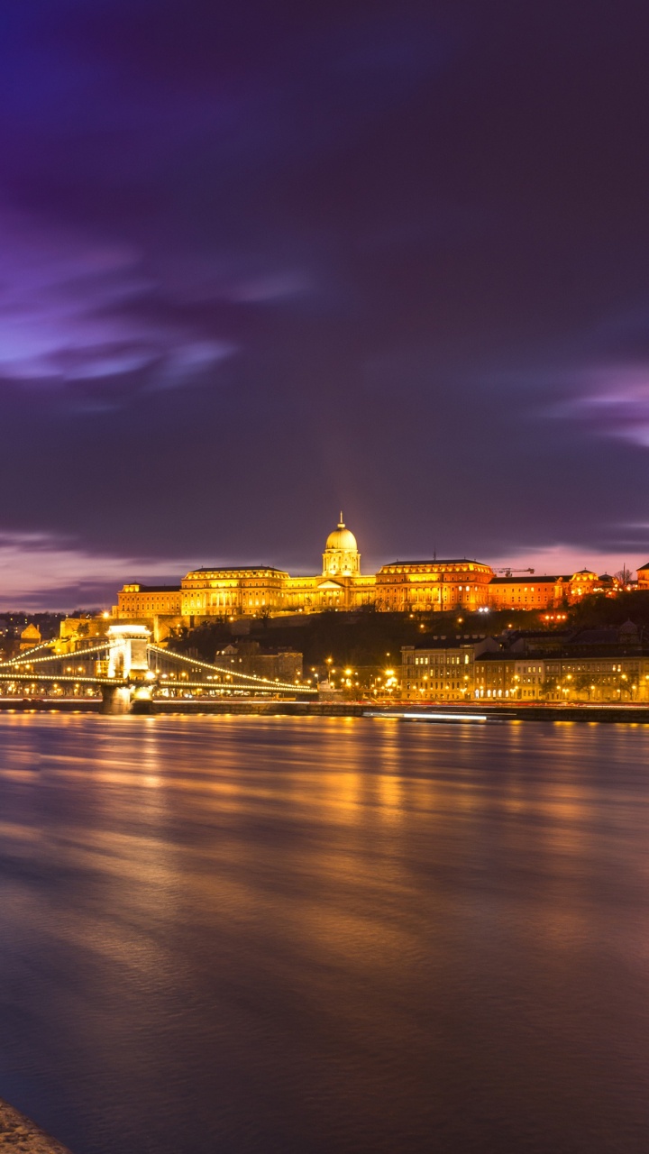 Body of Water Near City Buildings During Night Time. Wallpaper in 720x1280 Resolution