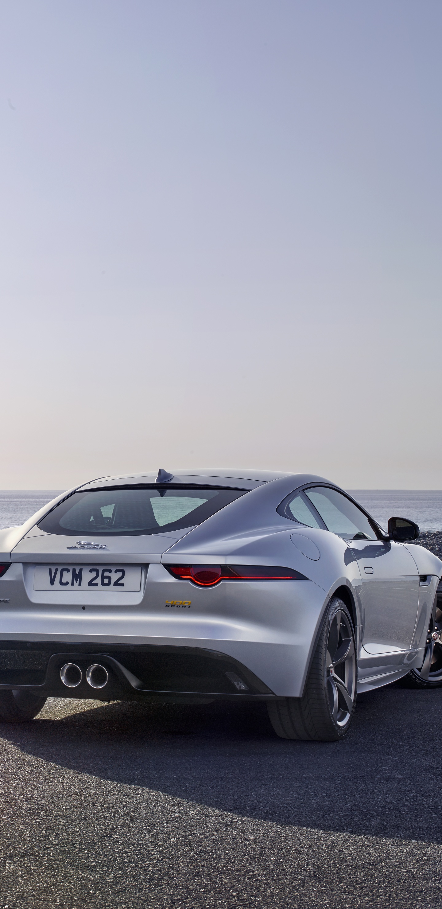 Silbernes Bmw m 3 Coupe Auf Grauer Asphaltstraße. Wallpaper in 1440x2960 Resolution