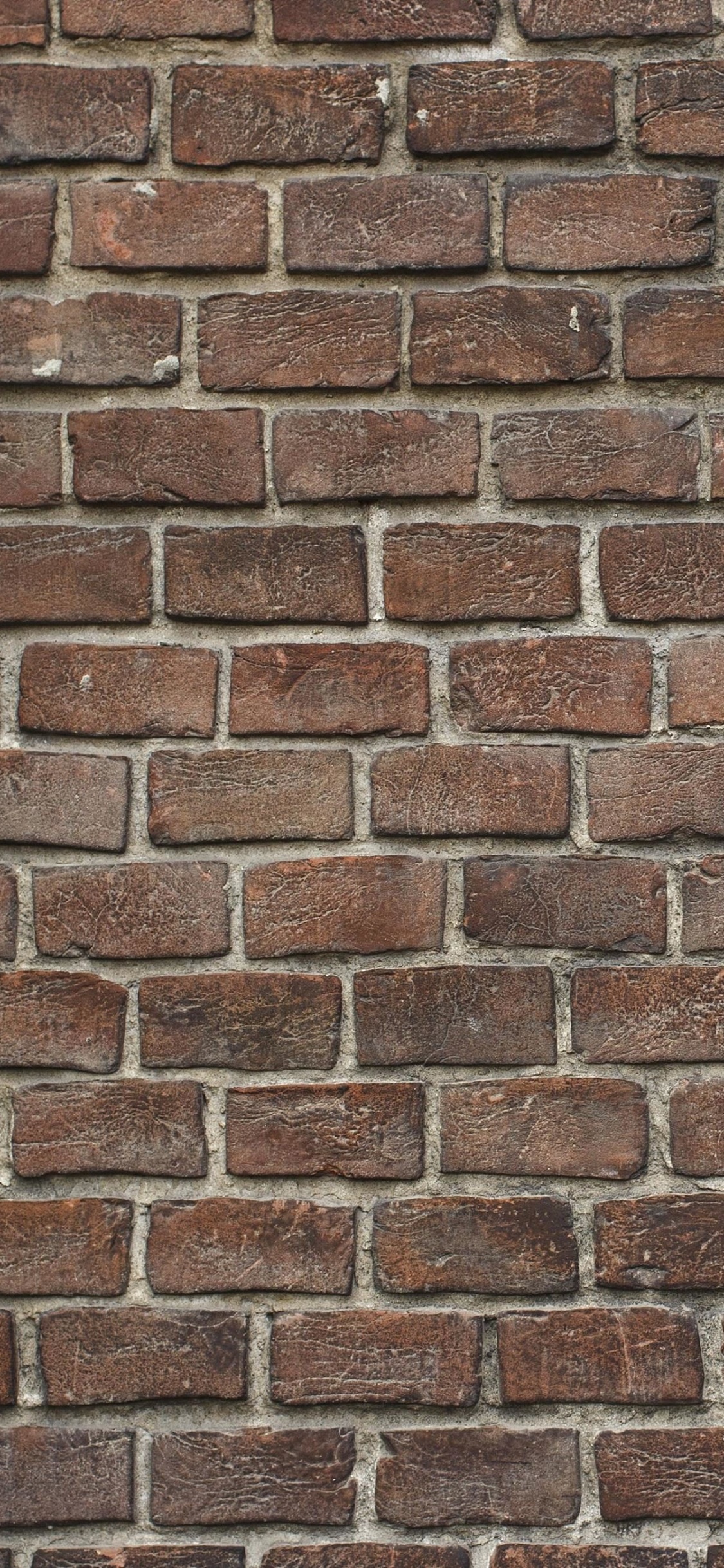 Brown and White Brick Wall. Wallpaper in 1125x2436 Resolution