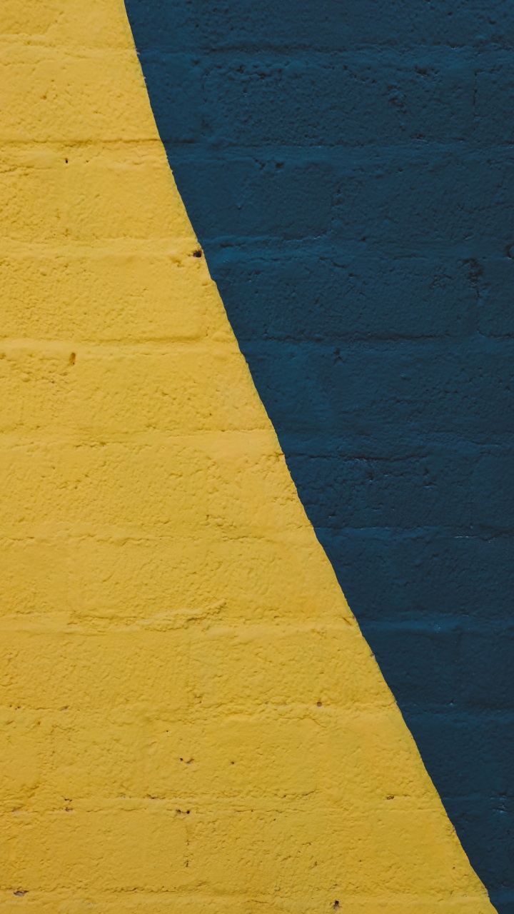 Pared Pintada de Amarillo Con Pintura Azul. Wallpaper in 720x1280 Resolution