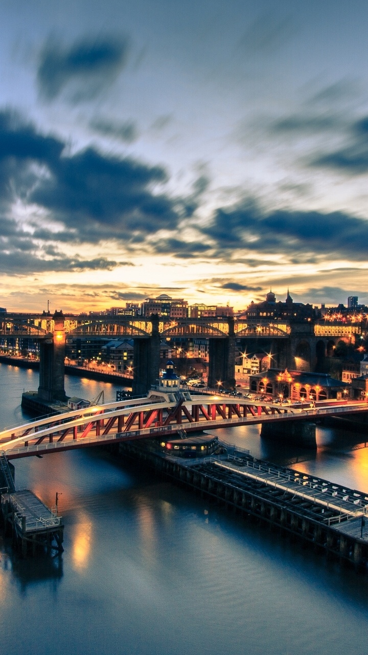 Bridge Over River During Night Time. Wallpaper in 720x1280 Resolution