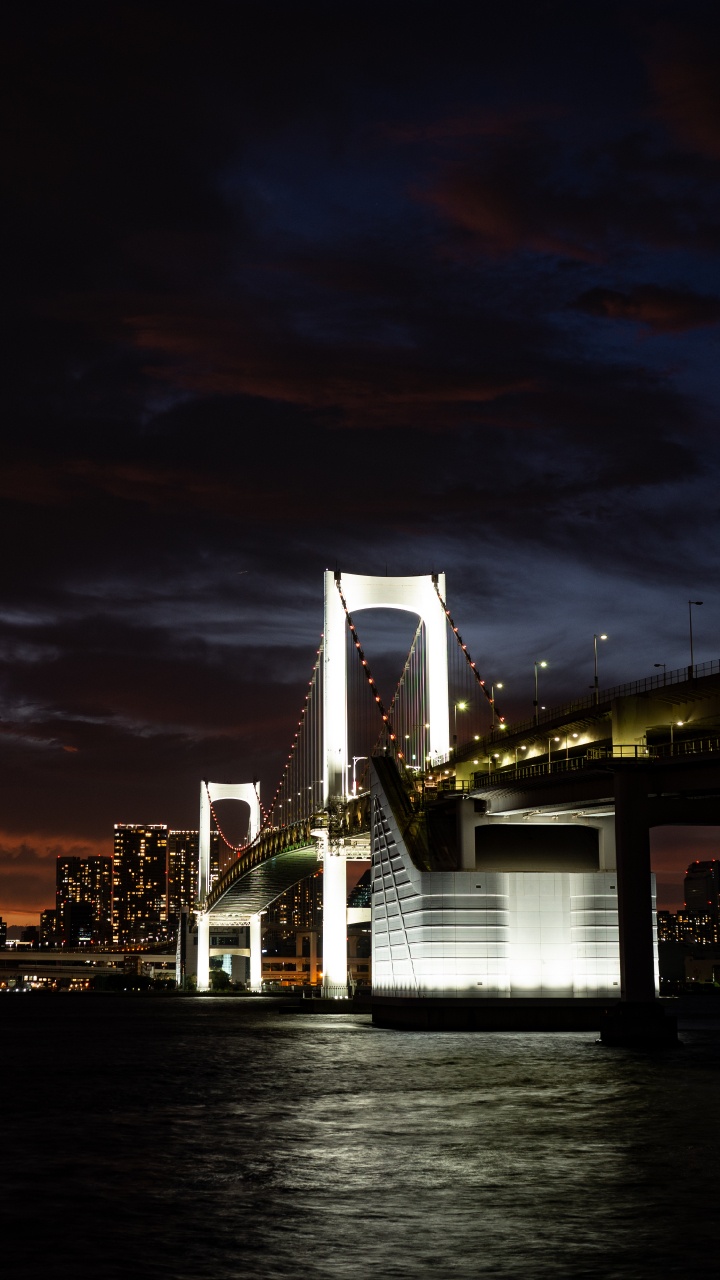 Bridge Over Water During Night Time. Wallpaper in 720x1280 Resolution