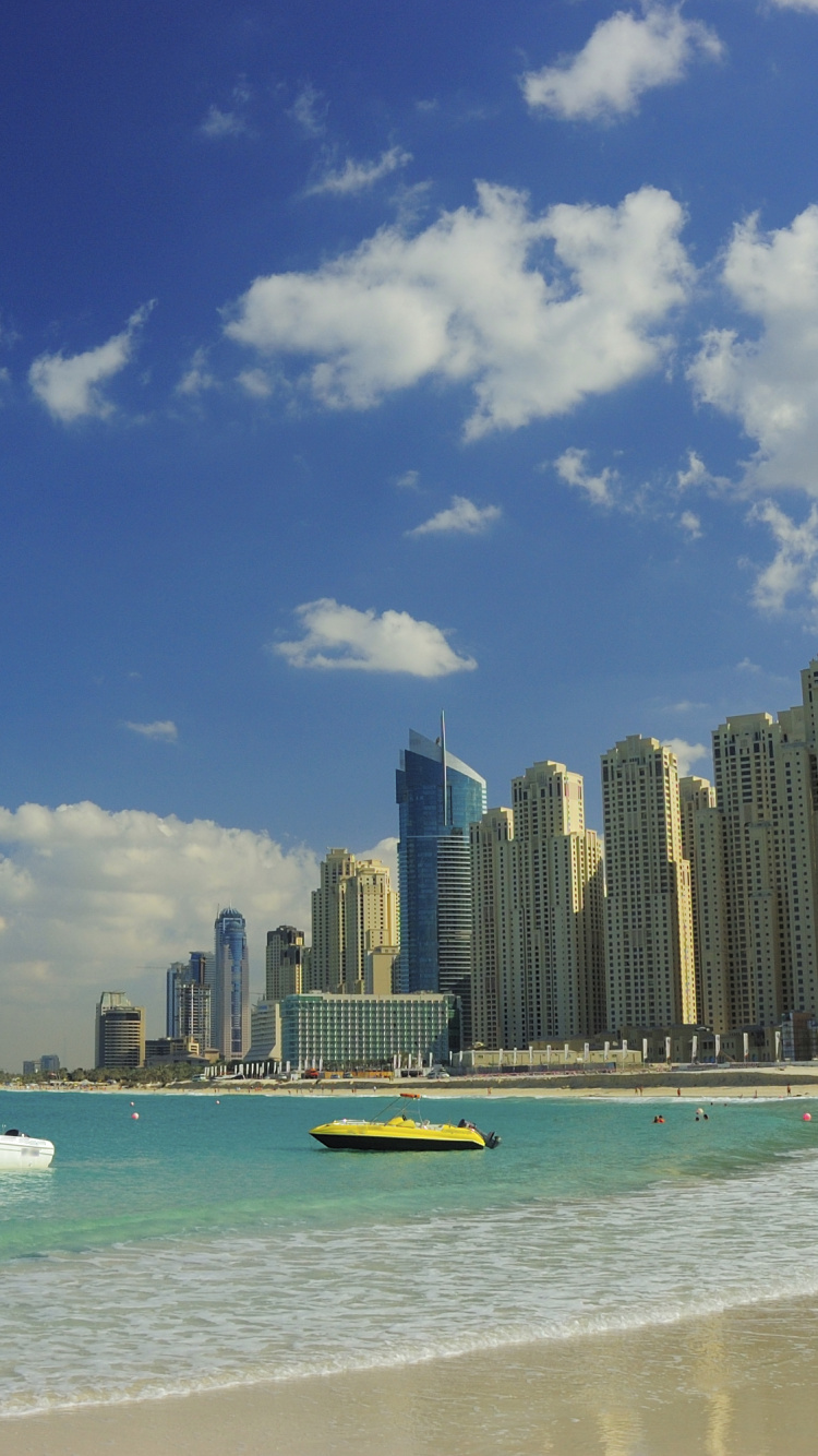 City Skyline Across The Sea During Daytime. Wallpaper in 750x1334 Resolution