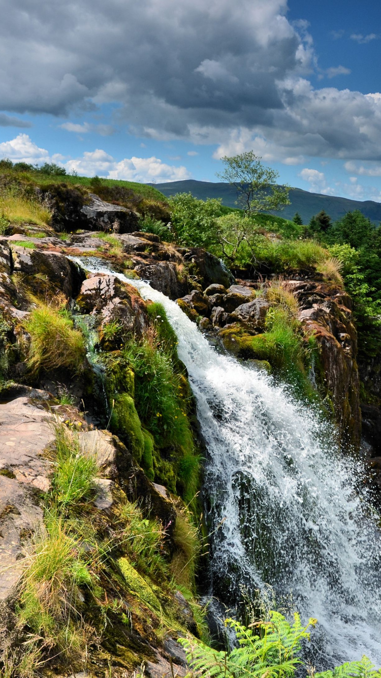 Water Falls on Green Grass Field Under White Clouds and Blue Sky During Daytime. Wallpaper in 750x1334 Resolution