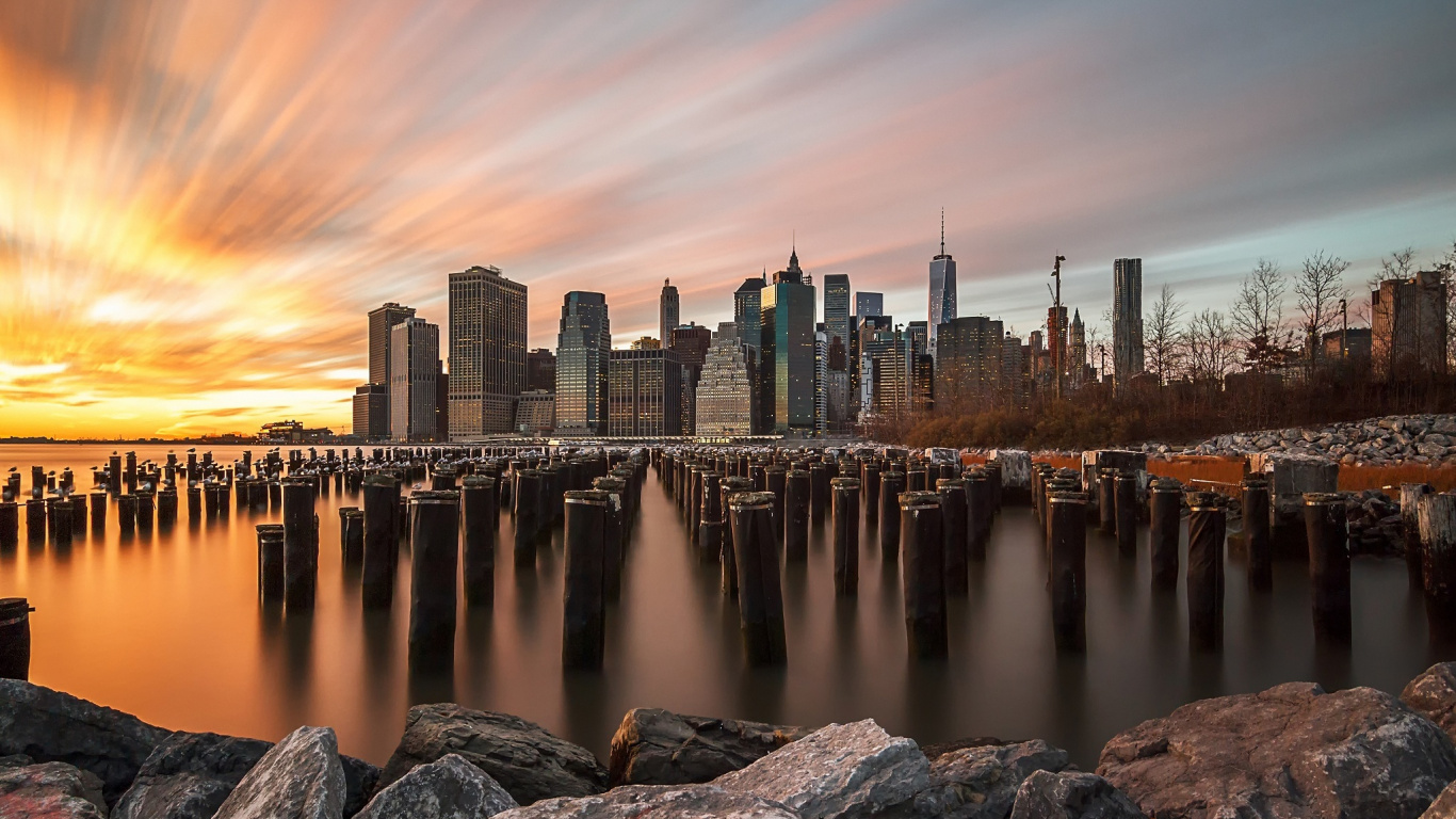 Body of Water Near City Buildings During Night Time. Wallpaper in 1366x768 Resolution