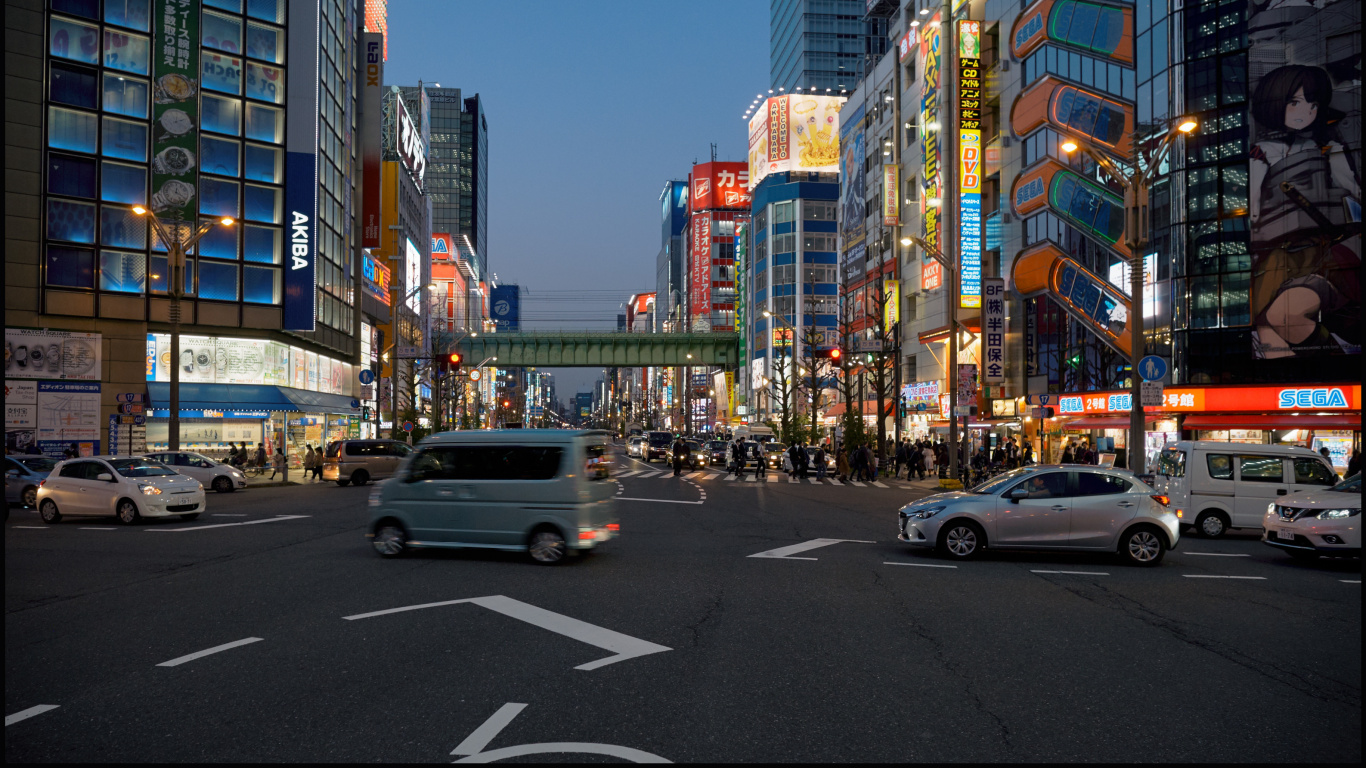 Cars on Road Near High Rise Buildings During Daytime. Wallpaper in 1366x768 Resolution