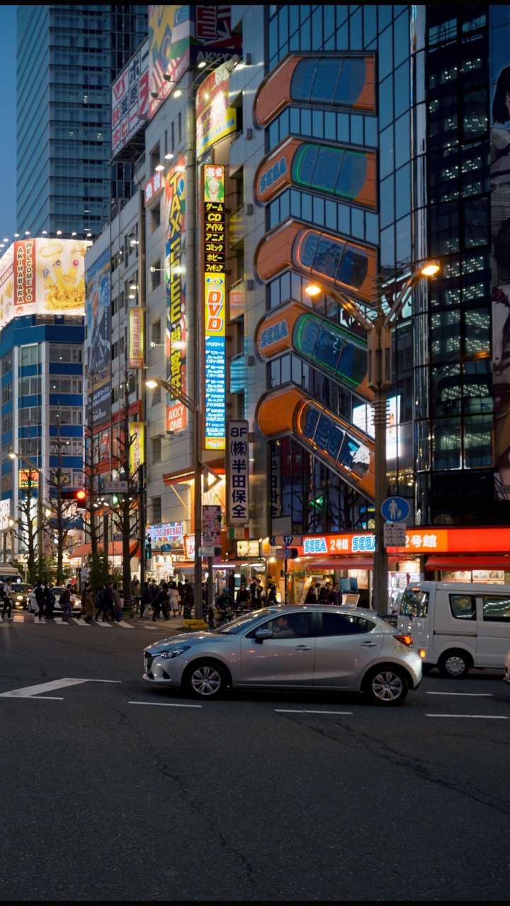 Cars on Road Near High Rise Buildings During Daytime. Wallpaper in 720x1280 Resolution