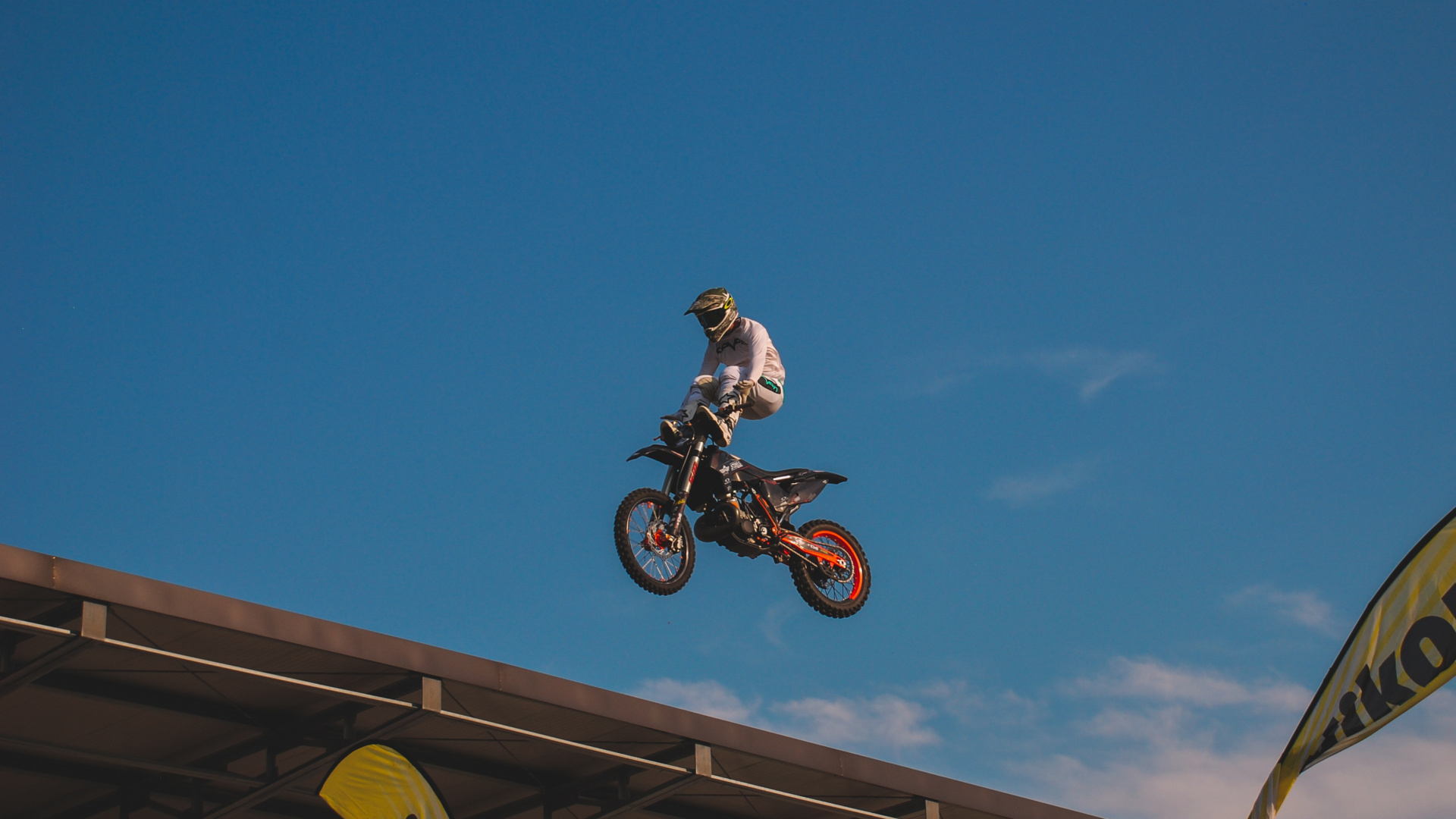 Man Riding Motocross Dirt Bike Under Blue Sky During Daytime. Wallpaper in 1920x1080 Resolution