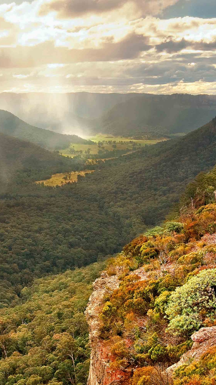 Green Mountains Under White Clouds During Daytime. Wallpaper in 720x1280 Resolution