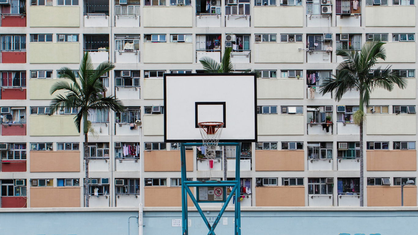 White and Pink Concrete Building Near Beach During Daytime. Wallpaper in 1366x768 Resolution