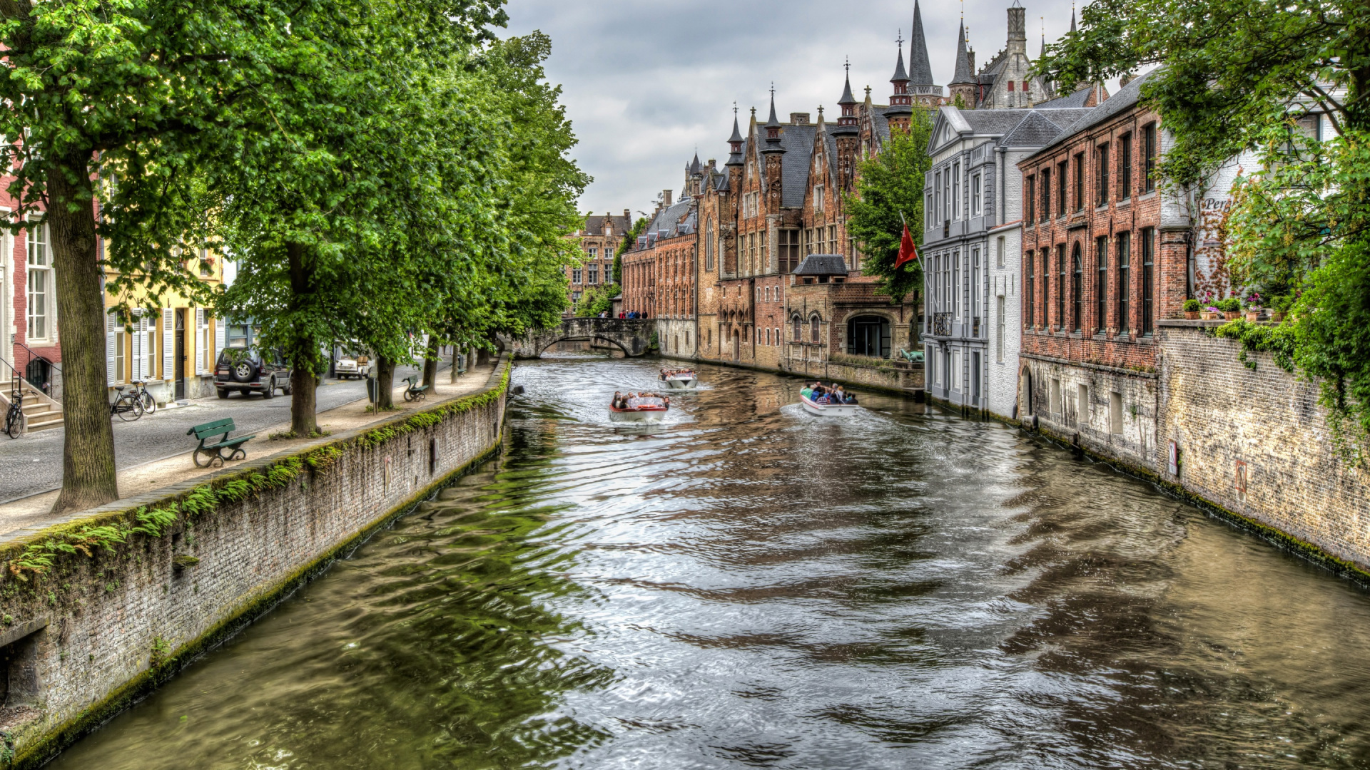 River Between Green Trees and Brown Concrete Building During Daytime. Wallpaper in 1920x1080 Resolution
