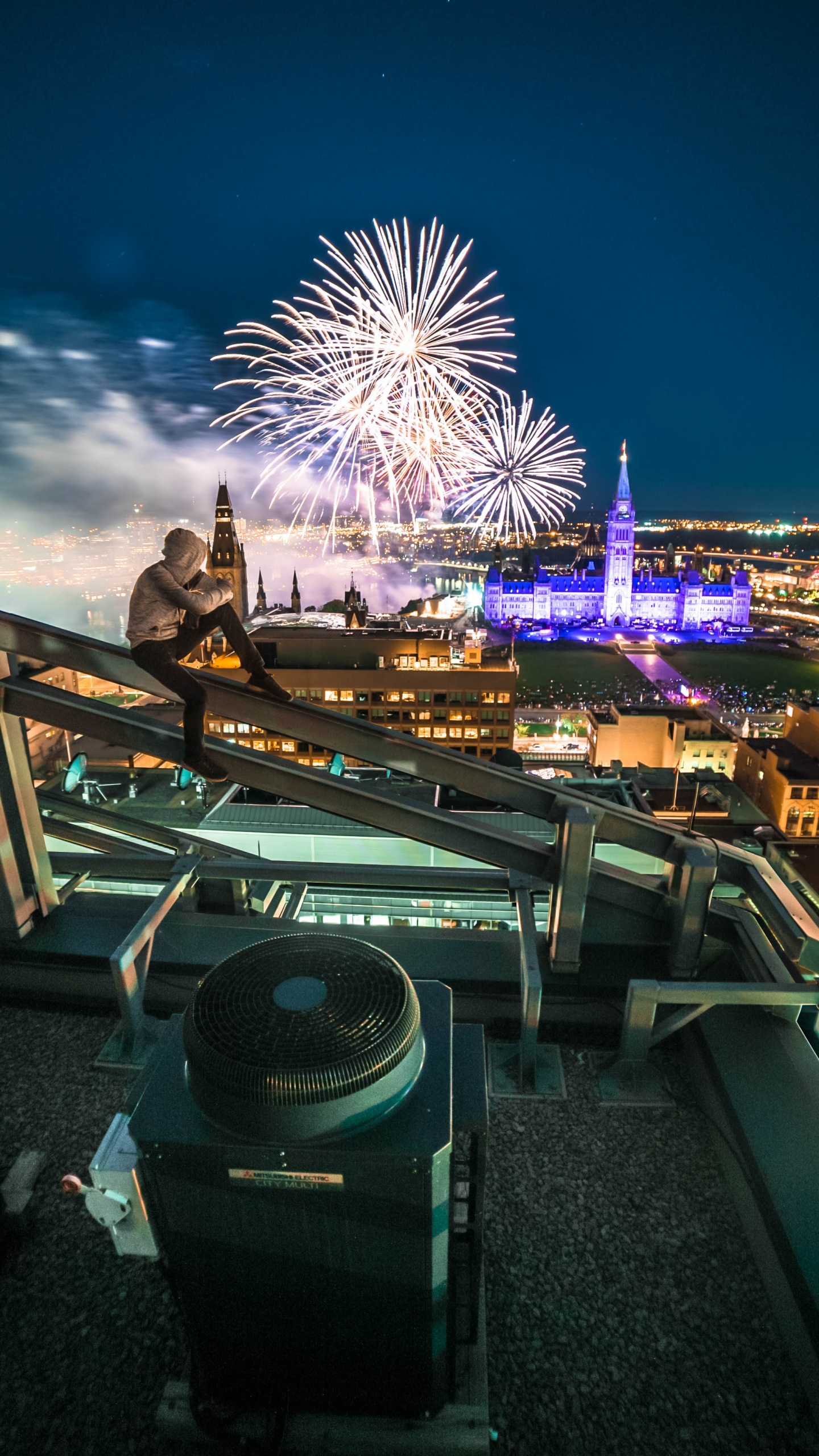 Man in Black Jacket Standing on Top of Building During Night Time. Wallpaper in 1440x2560 Resolution