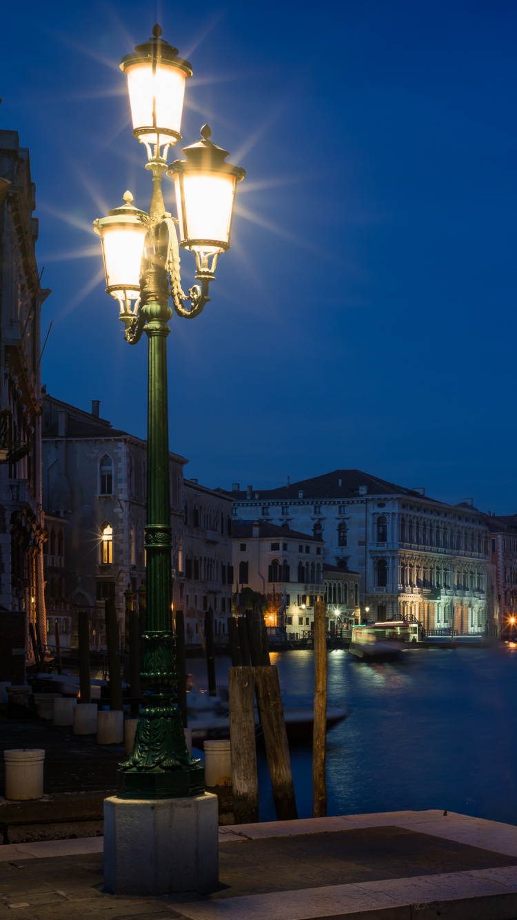 Body of Water Between Buildings During Night Time. Wallpaper in 750x1334 Resolution