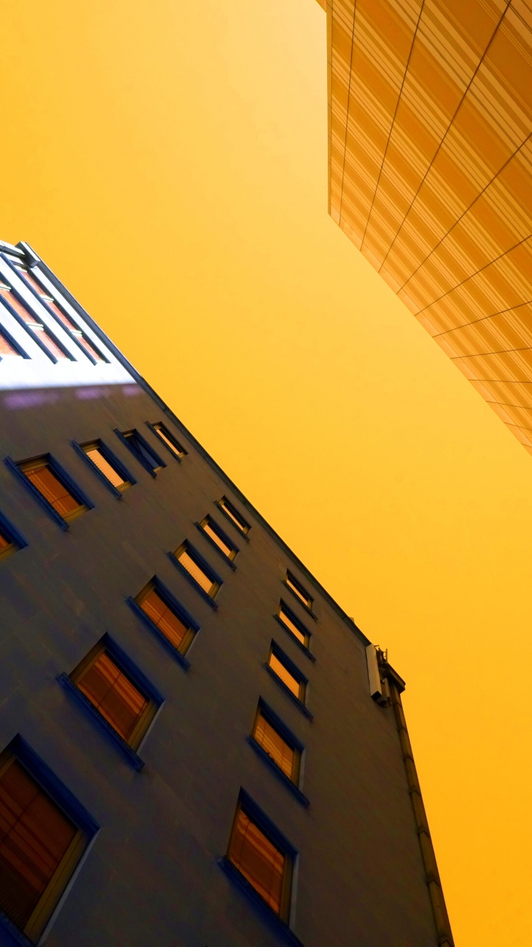 Brown Concrete Building During Daytime. Wallpaper in 750x1334 Resolution