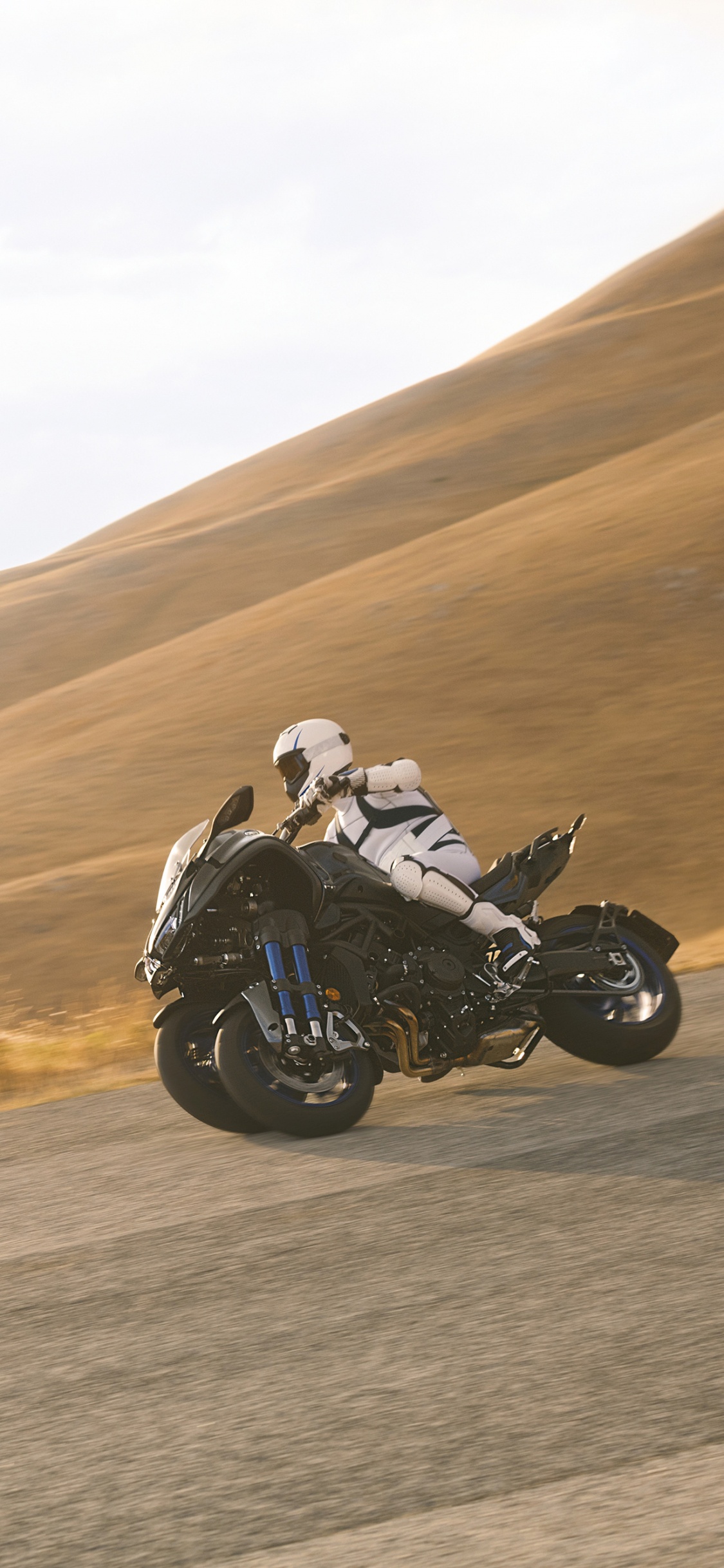 Black Sports Bike on Road During Daytime. Wallpaper in 1125x2436 Resolution