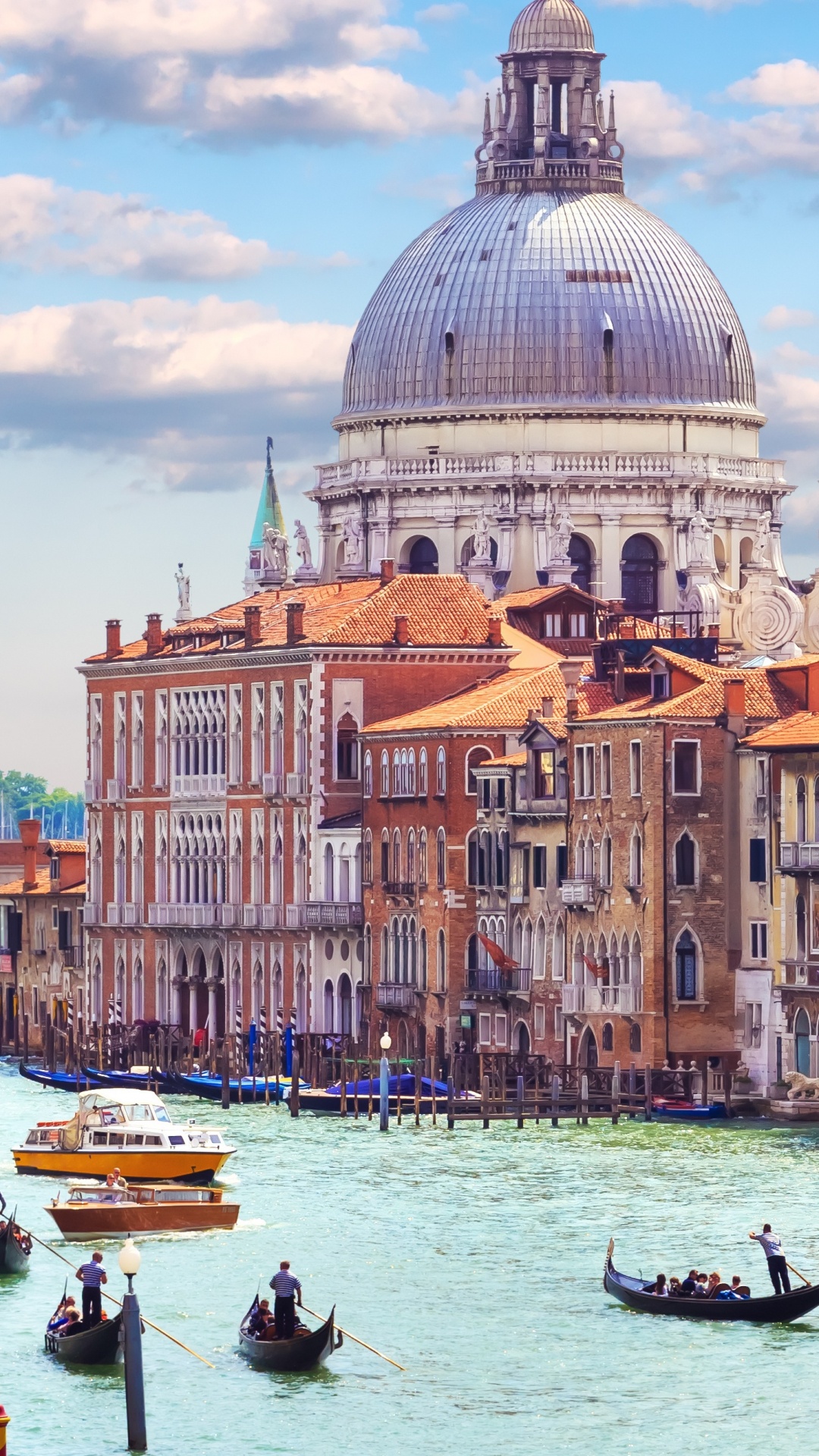 People Riding on Boat on Body of Water Near Brown Concrete Building During Daytime. Wallpaper in 1080x1920 Resolution