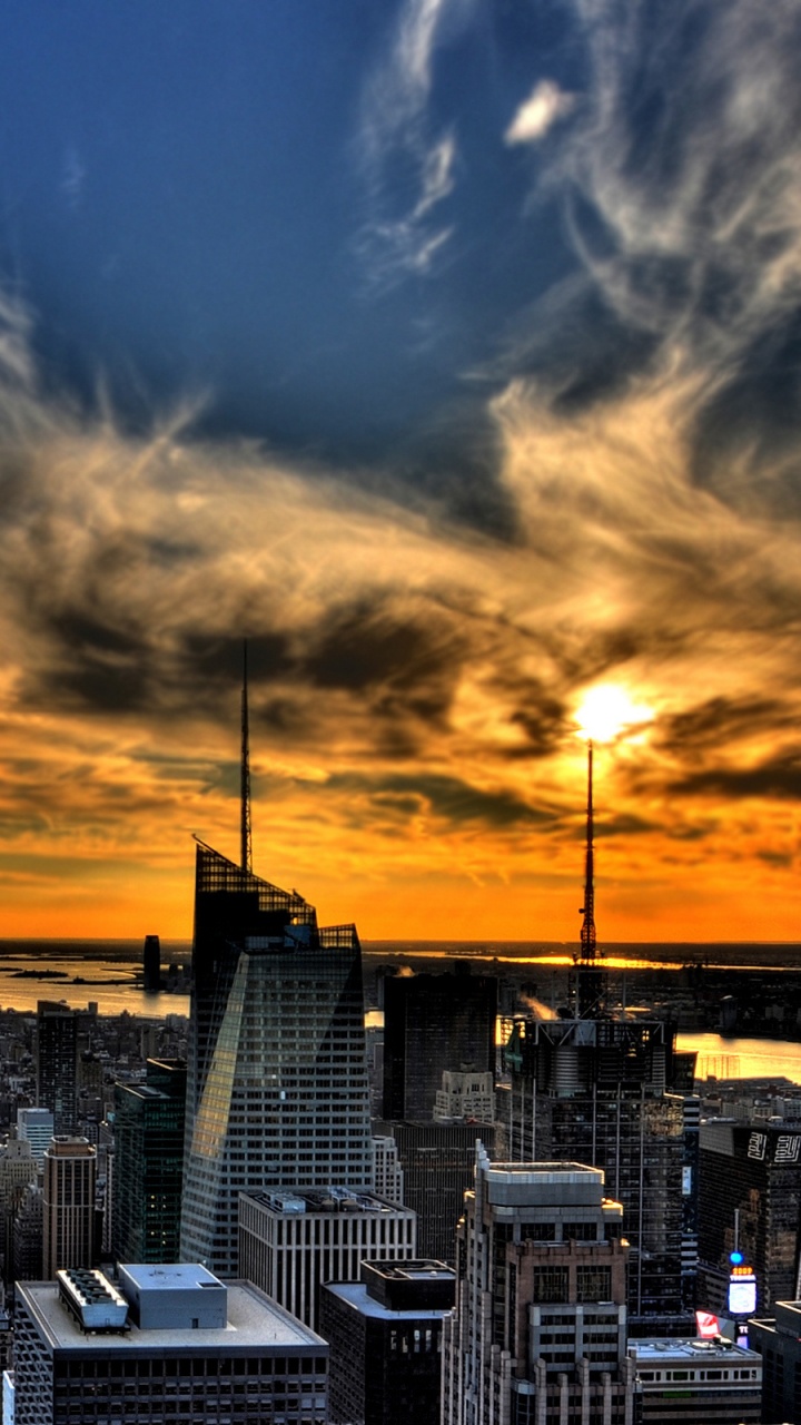 City With High Rise Buildings Under Blue Sky During Sunset. Wallpaper in 720x1280 Resolution