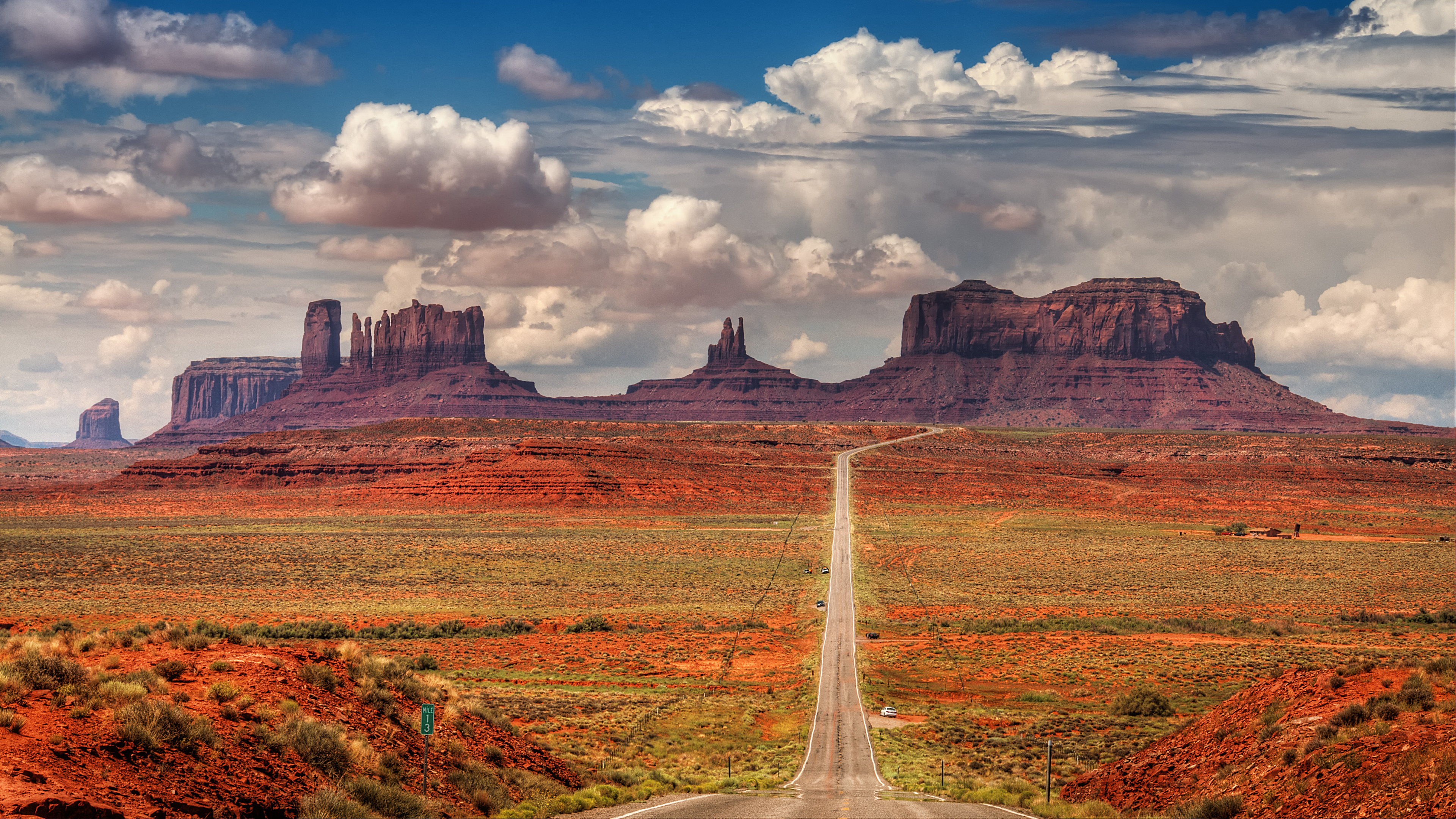 Brown and Green Grass Field Near Mountain Under White Clouds and Blue Sky During Daytime. Wallpaper in 3840x2160 Resolution