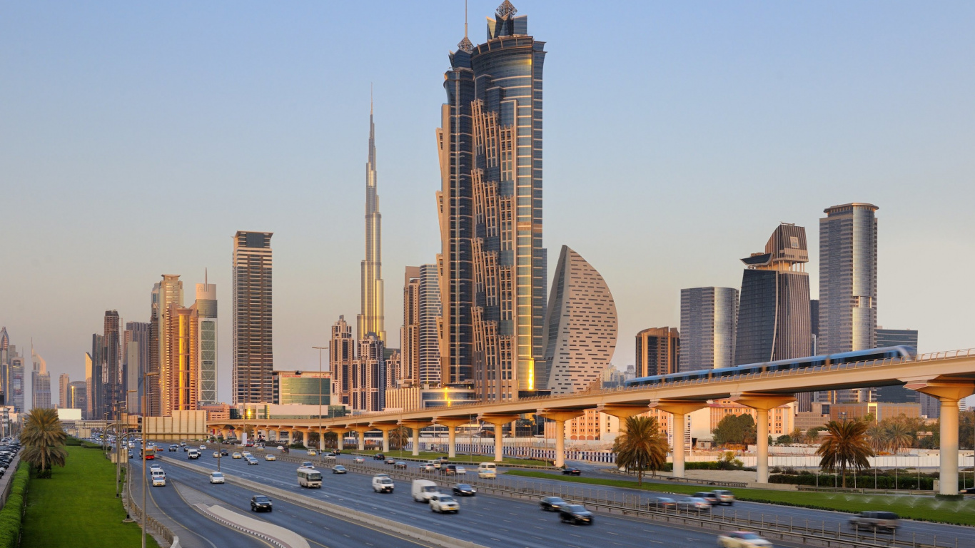 Cars on Road Near High Rise Buildings During Daytime. Wallpaper in 1366x768 Resolution