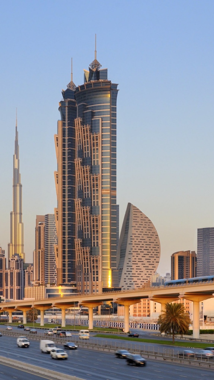Cars on Road Near High Rise Buildings During Daytime. Wallpaper in 720x1280 Resolution