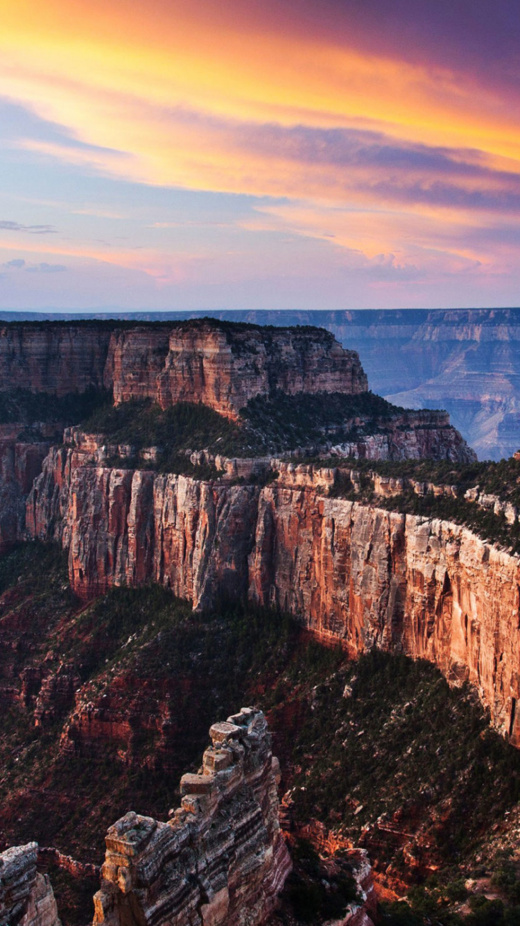 Brown Rocky Mountain Under Cloudy Sky During Daytime. Wallpaper in 750x1334 Resolution