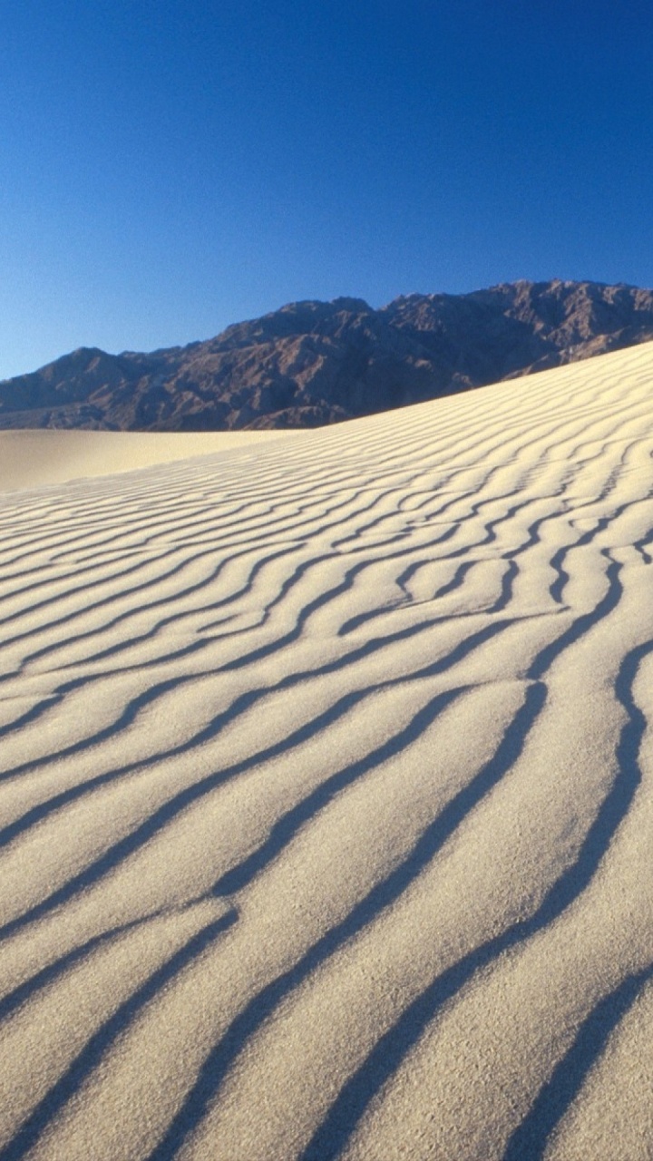Brown Sand Under Blue Sky During Daytime. Wallpaper in 720x1280 Resolution