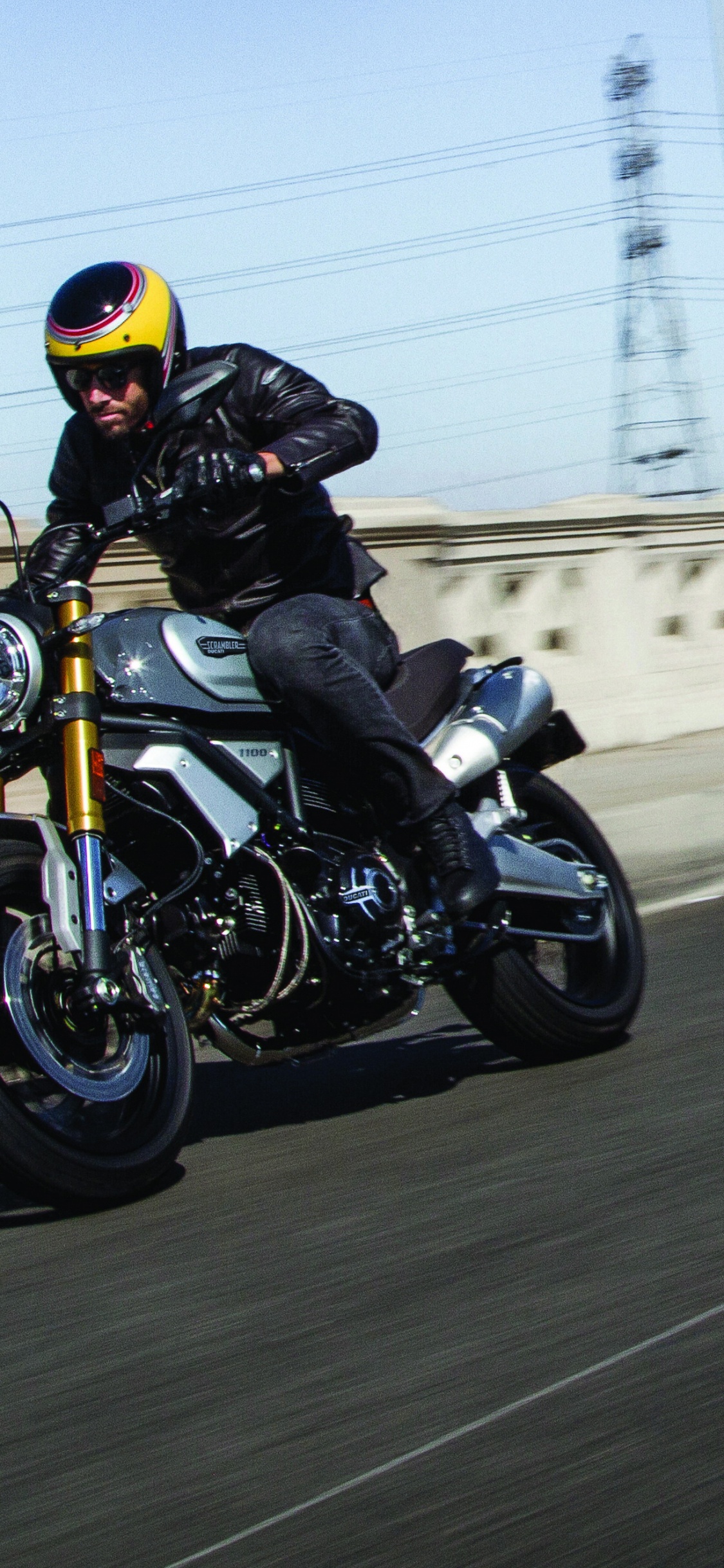 Man in Black Helmet Riding Motorcycle on Road During Daytime. Wallpaper in 1125x2436 Resolution