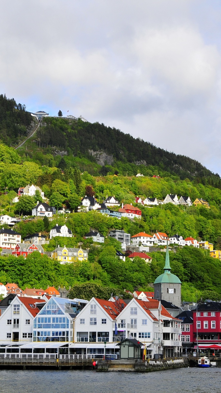 White and Brown Houses Near Green Mountain Under White Clouds During Daytime. Wallpaper in 720x1280 Resolution