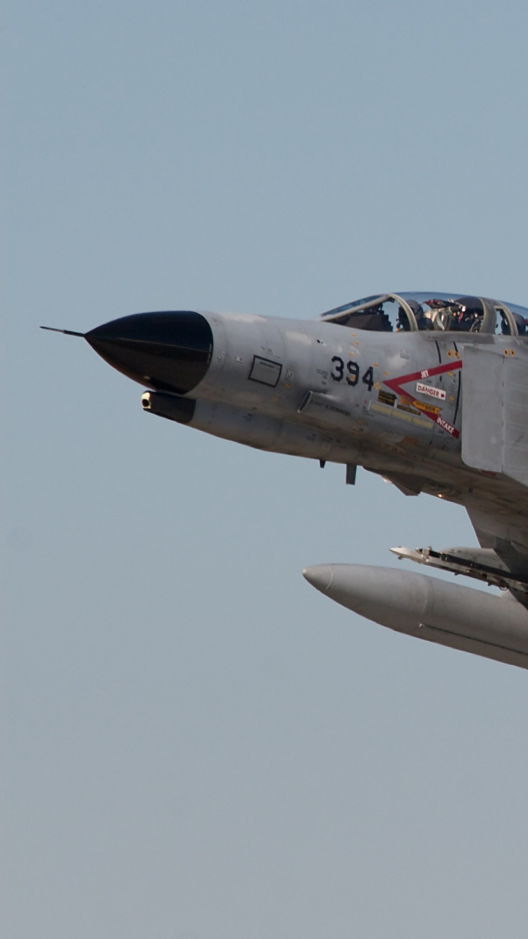 Gray Fighter Jet in Mid Air. Wallpaper in 750x1334 Resolution