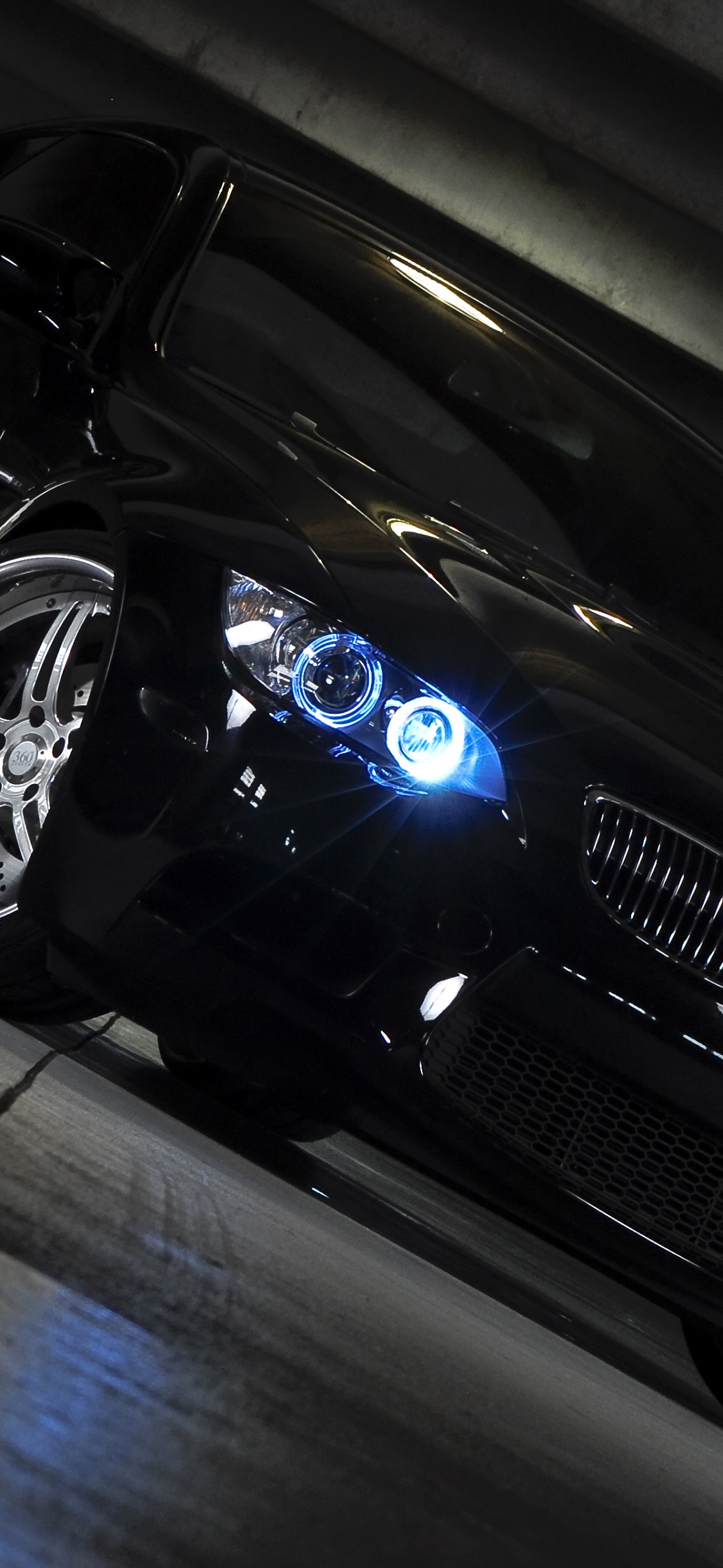 Black Porsche 911 on Road. Wallpaper in 1125x2436 Resolution