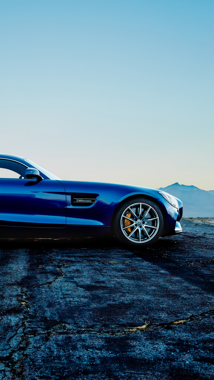Blue Porsche 911 on Black Sand. Wallpaper in 750x1334 Resolution