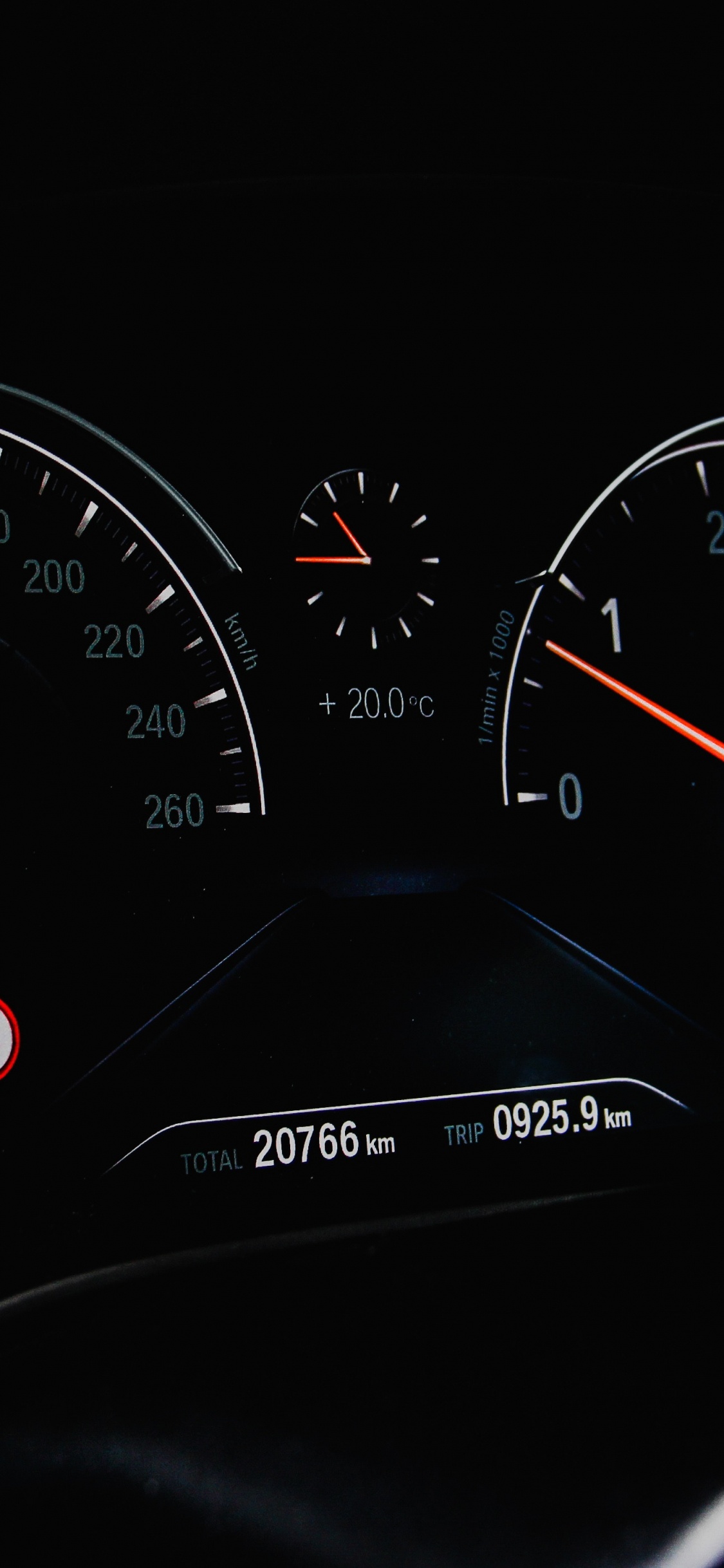 Black Car Instrument Panel Cluster. Wallpaper in 1125x2436 Resolution