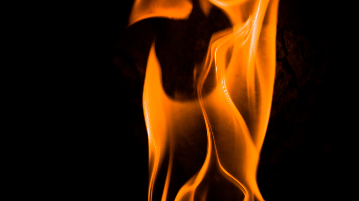 Orange Fire in Black Background. Wallpaper in 1366x768 Resolution