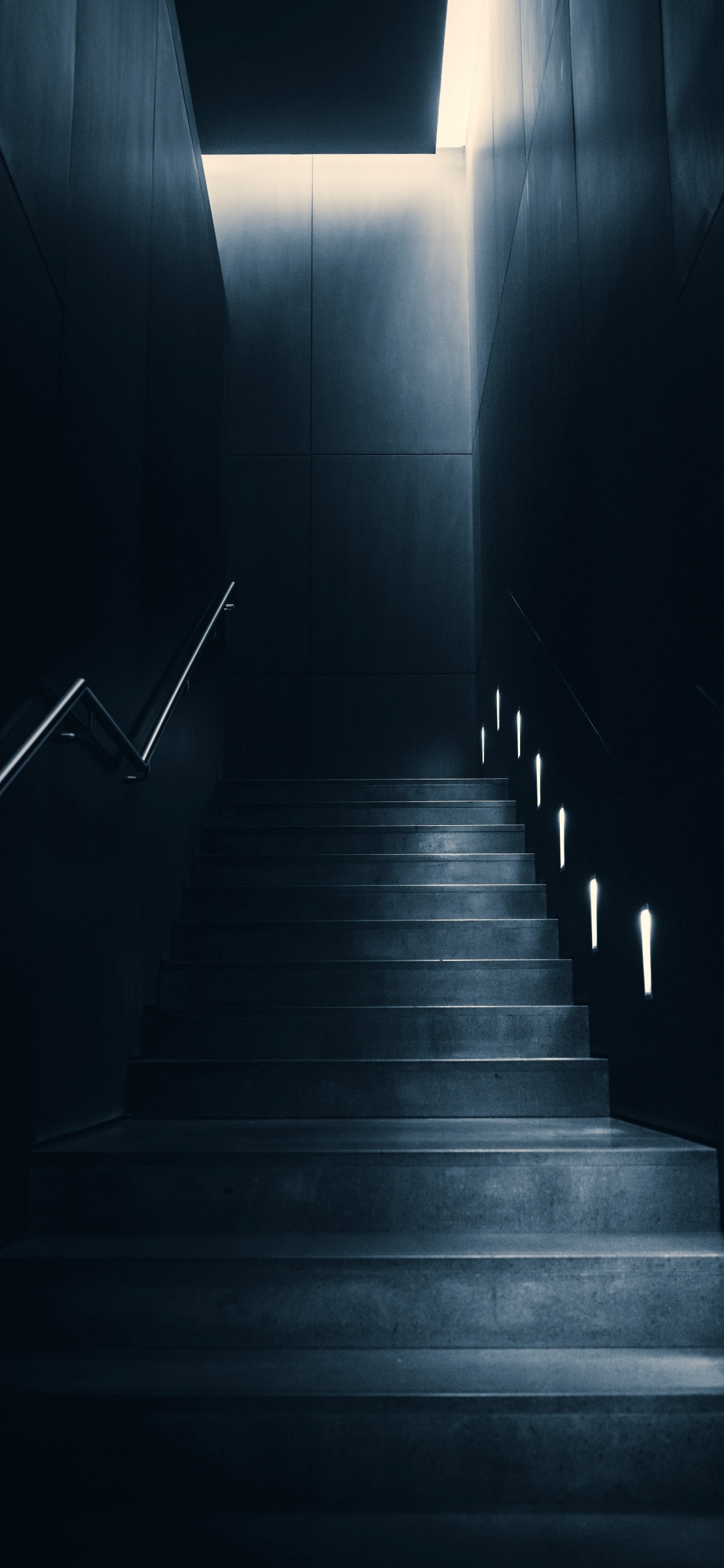 Gray Concrete Staircase With Black Metal Railings. Wallpaper in 1125x2436 Resolution