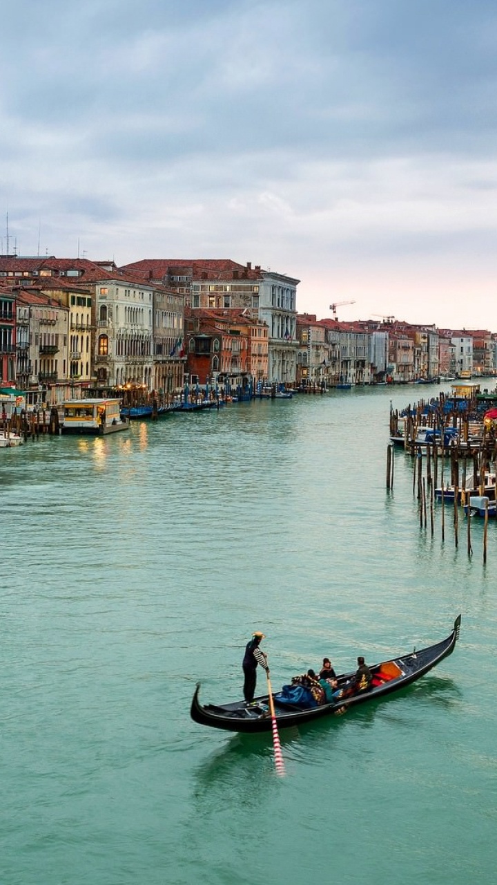People Riding on Boat on River Near Buildings During Daytime. Wallpaper in 720x1280 Resolution