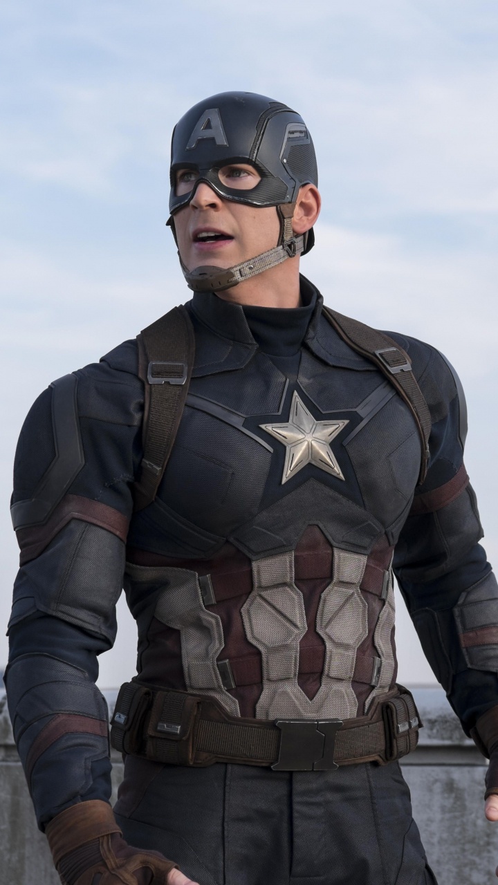 Man in Black and Brown Camouflage Suit Standing on Dock During Daytime. Wallpaper in 720x1280 Resolution