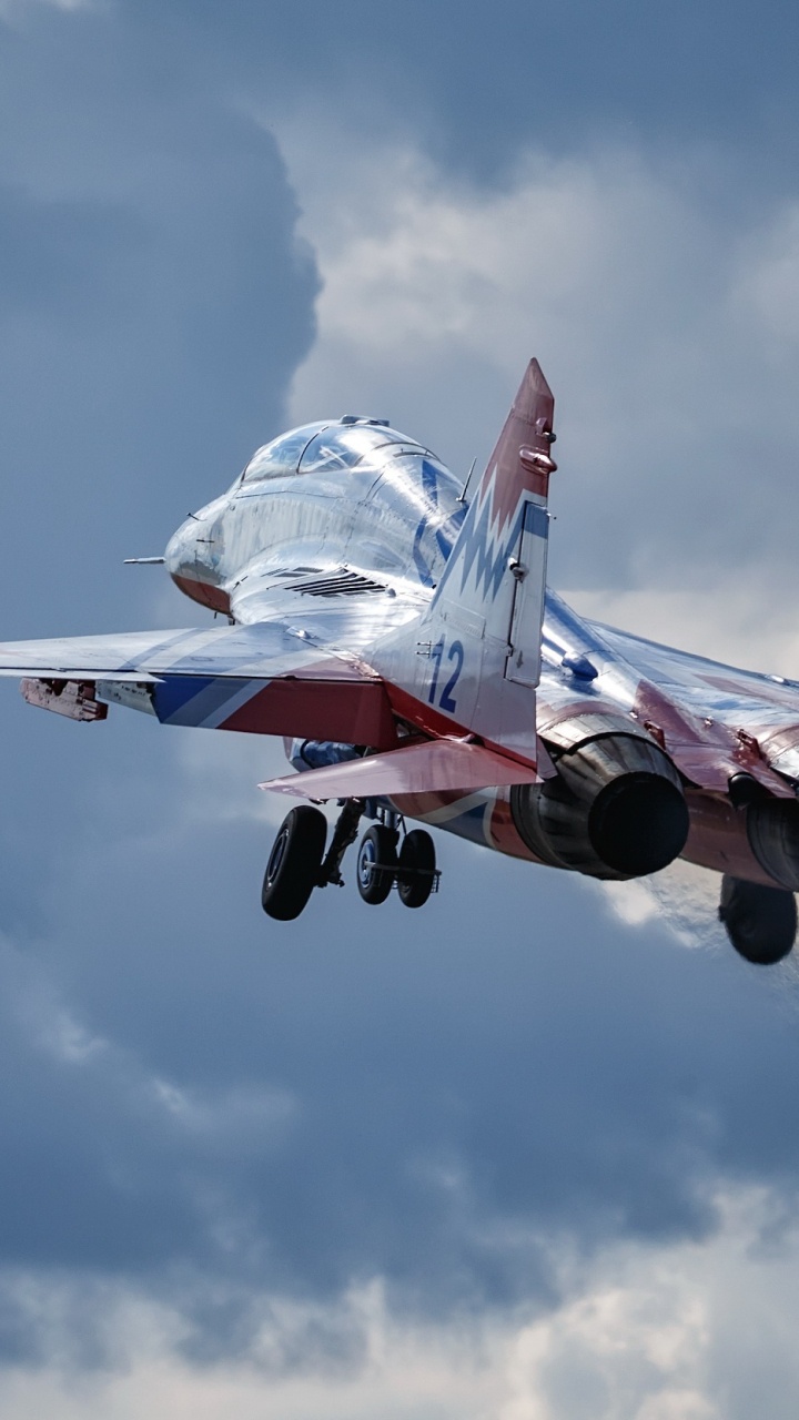 White and Red Jet Plane Flying in The Sky During Daytime. Wallpaper in 720x1280 Resolution