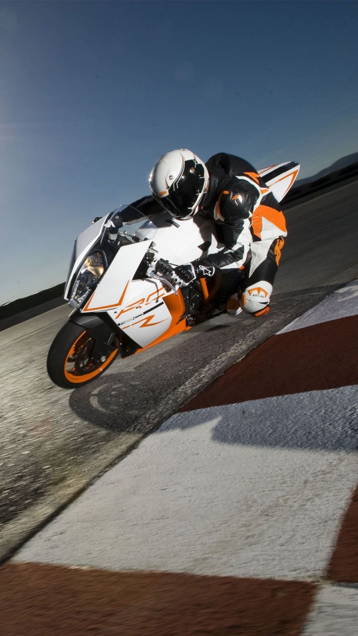 Man Riding on Black and White Sports Bike. Wallpaper in 720x1280 Resolution