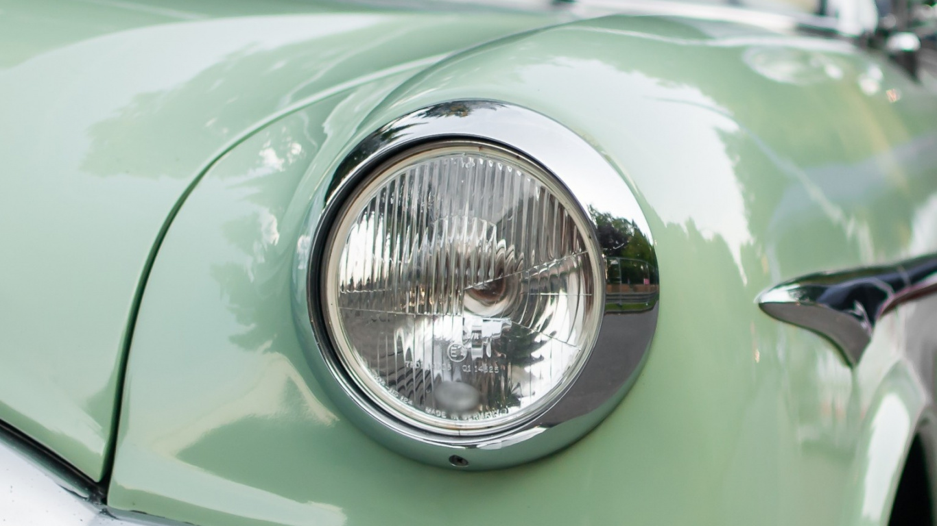 Green Car With Chrome Headlight. Wallpaper in 1366x768 Resolution