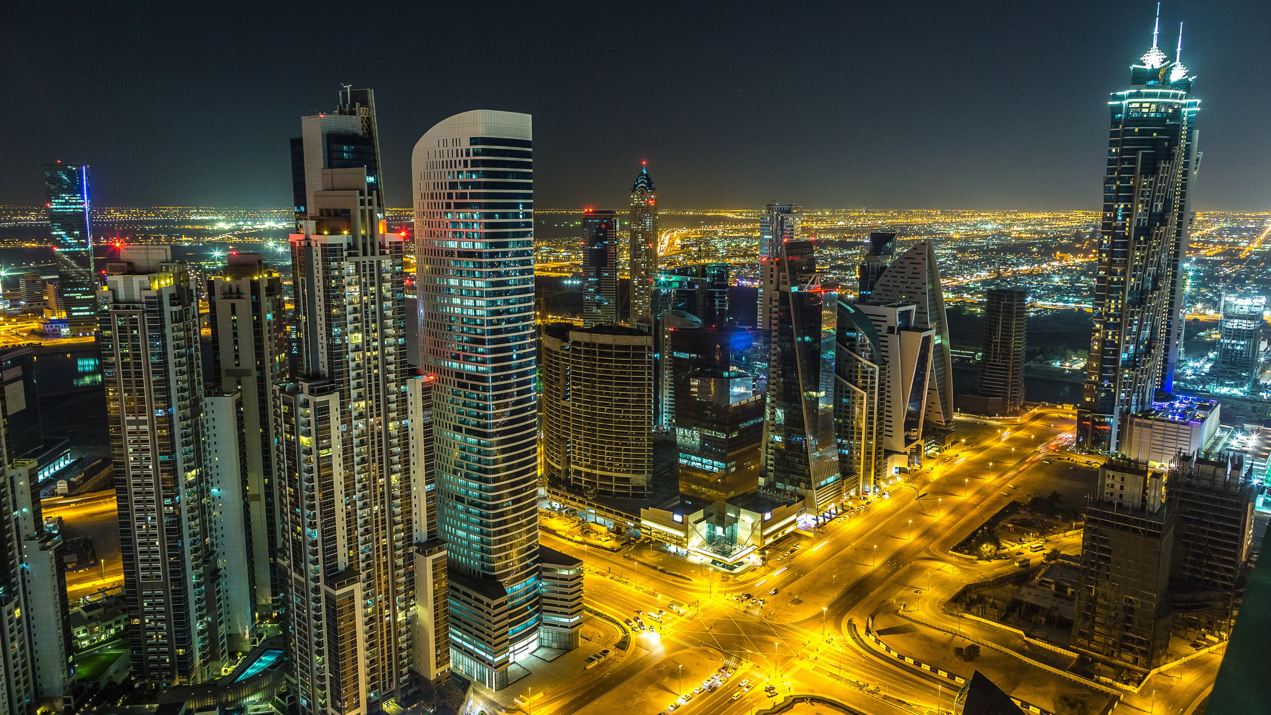 City Buildings During Night Time. Wallpaper in 2560x1440 Resolution
