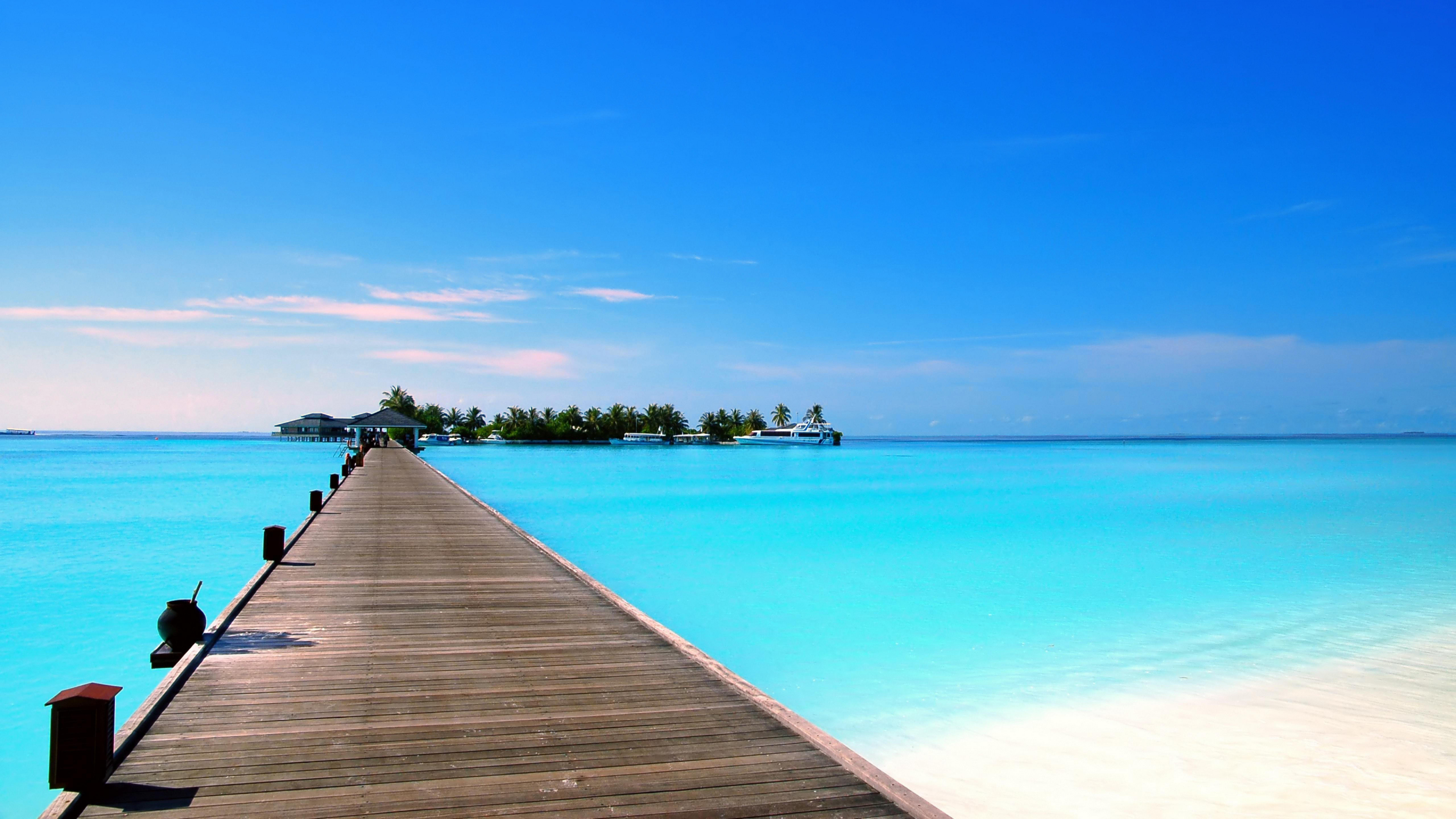 Brown Wooden Dock on Blue Sea Under Blue Sky During Daytime. Wallpaper in 3840x2160 Resolution