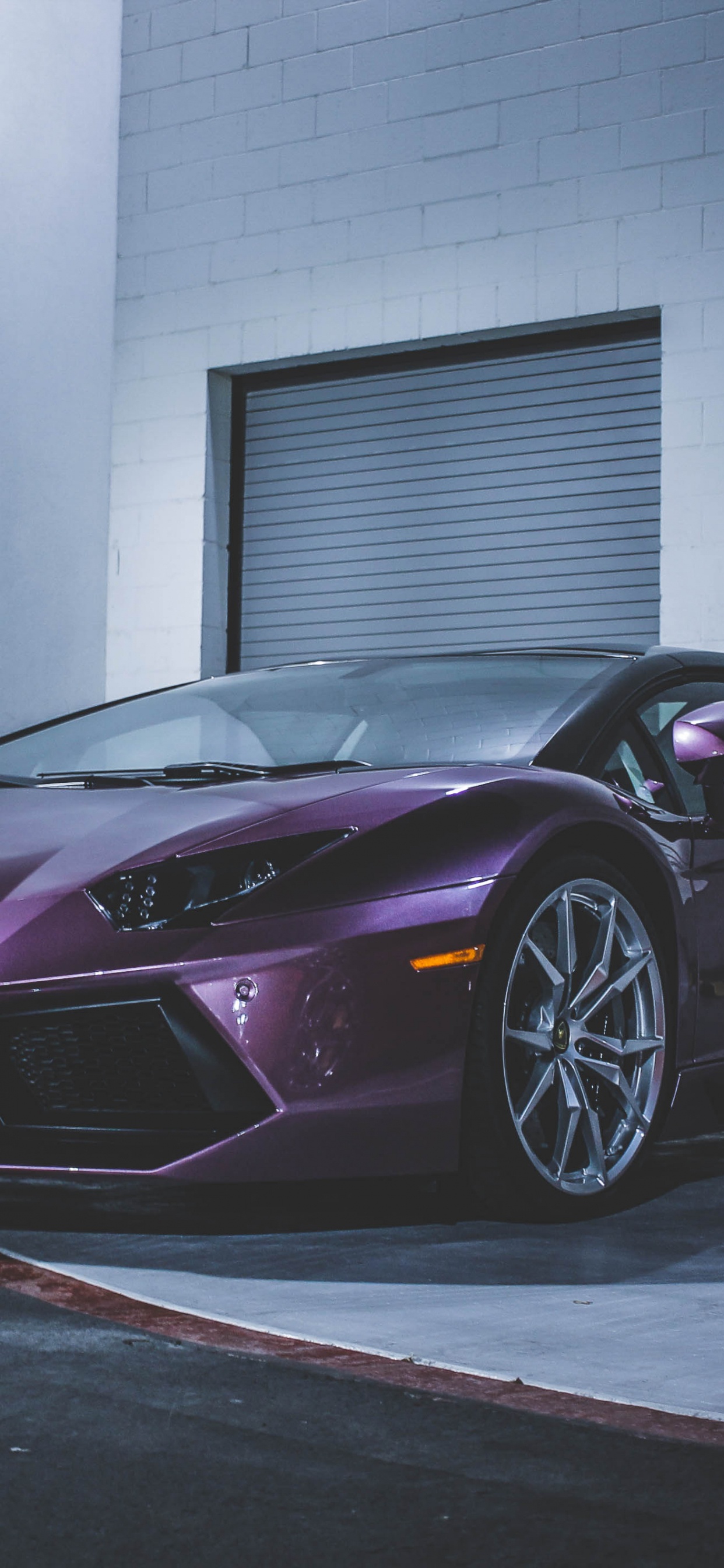 Purple Ferrari 458 Italia Parked Near White Wall. Wallpaper in 1242x2688 Resolution