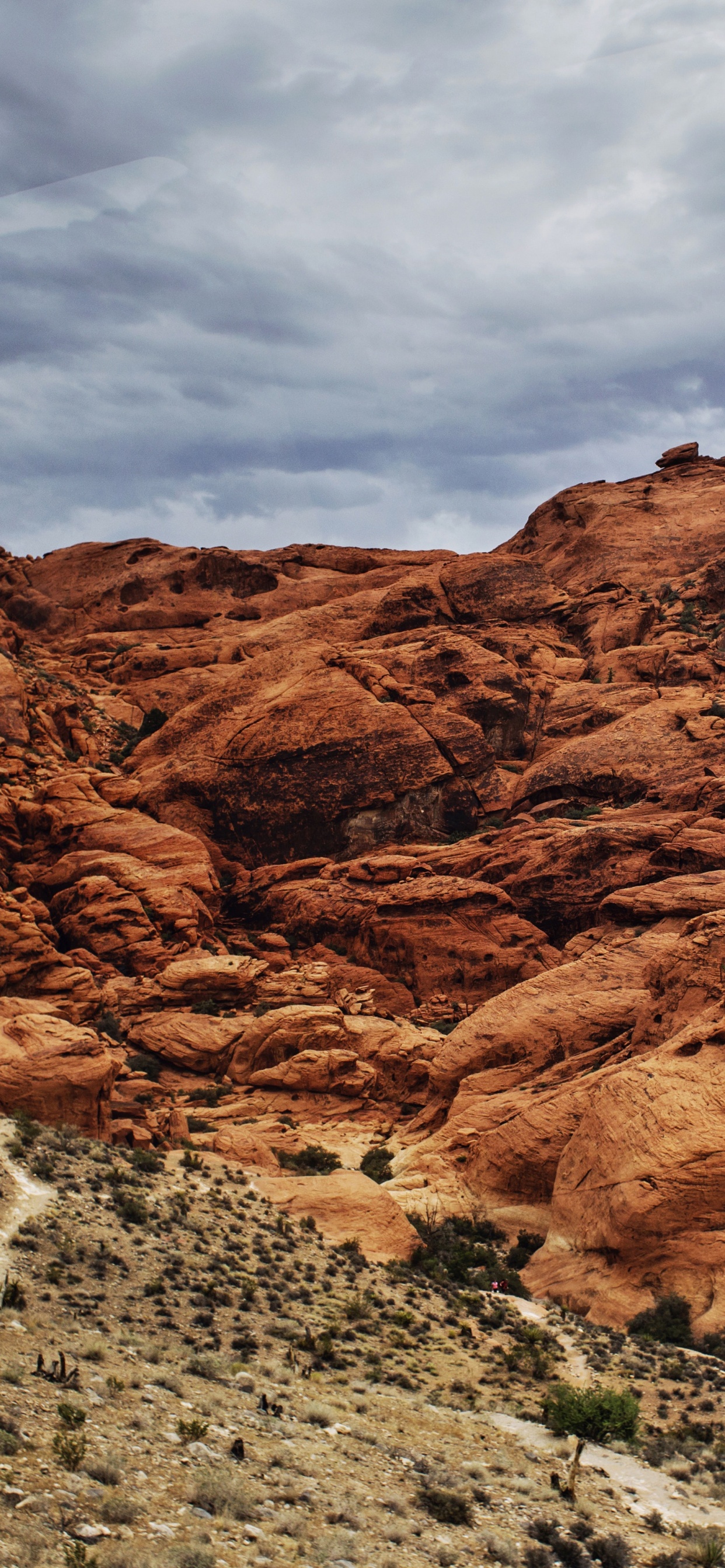 Brown Rocky Mountain Under Cloudy Sky During Daytime. Wallpaper in 1242x2688 Resolution